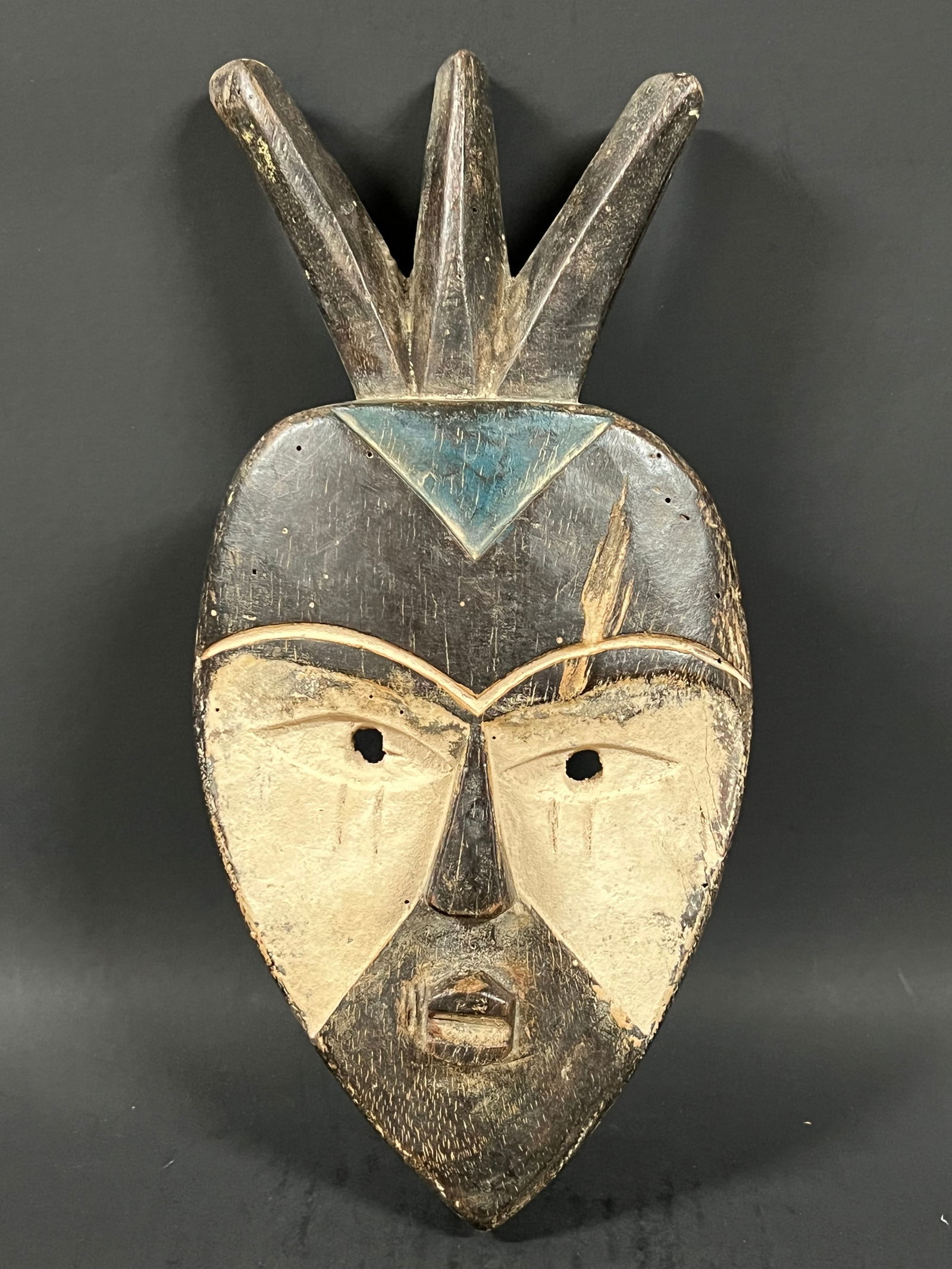 Vuvi Mask: African Tribal Art Carved Wood Vuvi Mask. The dimension is 12 inches high x 6 inches wide. Please be aware that some of the items are vintage, secondhand, old ages, antiques and may have a defects or