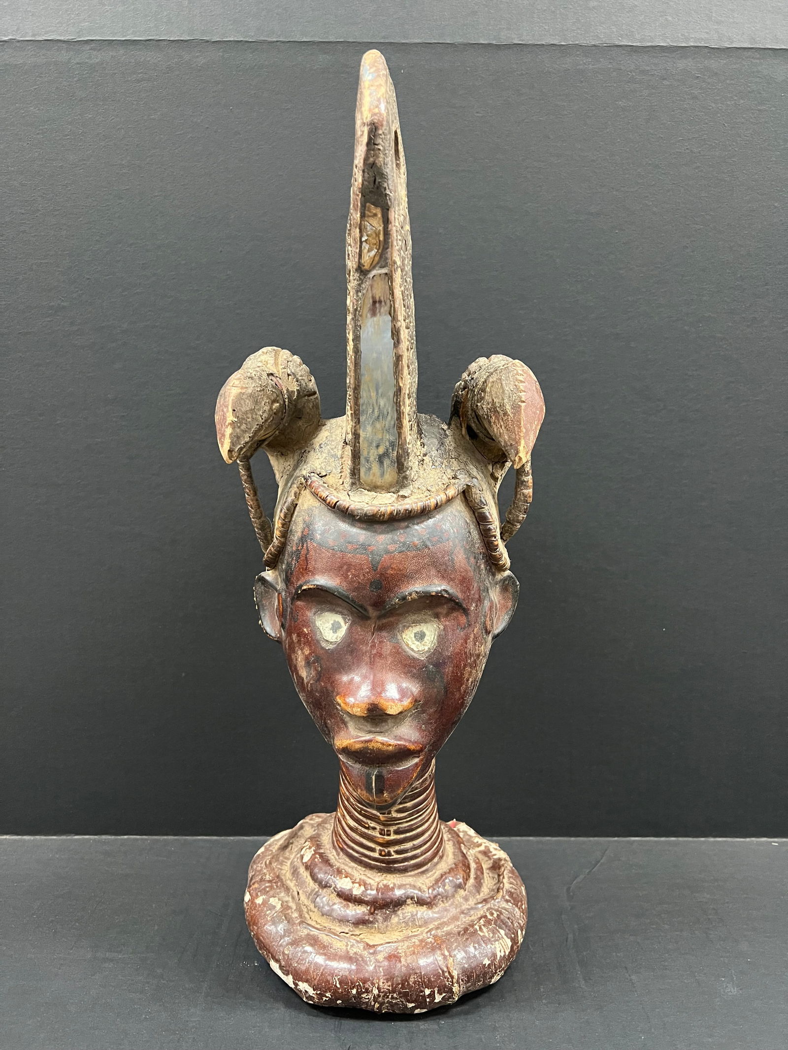 Ekoi Ejagham Head Sculpture: African Tribal Art Carved Wood Ekoi Ejagham Head Sculpture. The dimension is 19 inches high x 9 inches wide. Please be aware that some of the items are vintage, secondhand, old ages, antiques and may