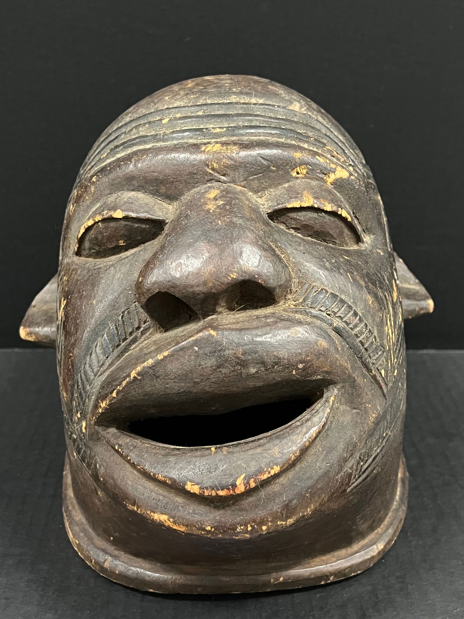 Makonde Helmet Mask: African Tribal Art Carved Wood Makonde Helmet Mask. The dimension is 9 inches high x 9 inches wide. Please be aware that some of the items are vintage, secondhand, old ages, antiques and may have a
