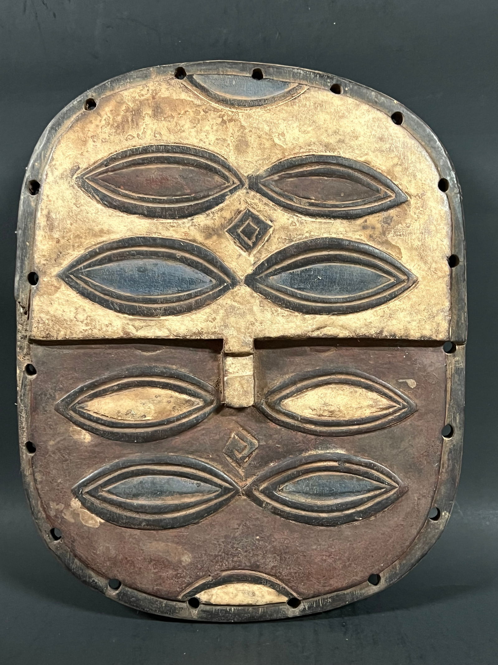Teke Mask: African Tribal Art Carved Wood Teke Mask. The dimension is 13 inches high x 10.5 inches wide. Please be aware that some of the items are vintage, secondhand, old ages, antiques and may have a defects