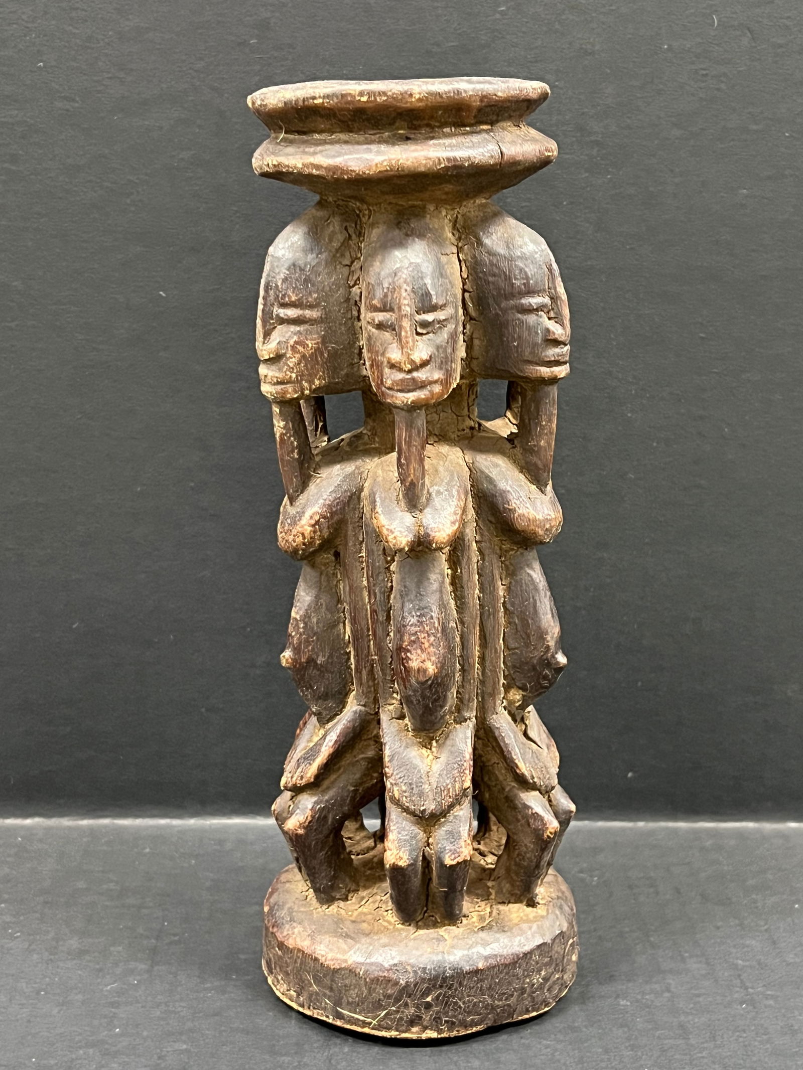 Dogon Statue: African Tribal Art Carved Wood Dogon Statue. The dimension is 10.5 inches high x 4 inches wide. Please be aware that some of the items are vintage, secondhand, old ages, antiques and may have a defect