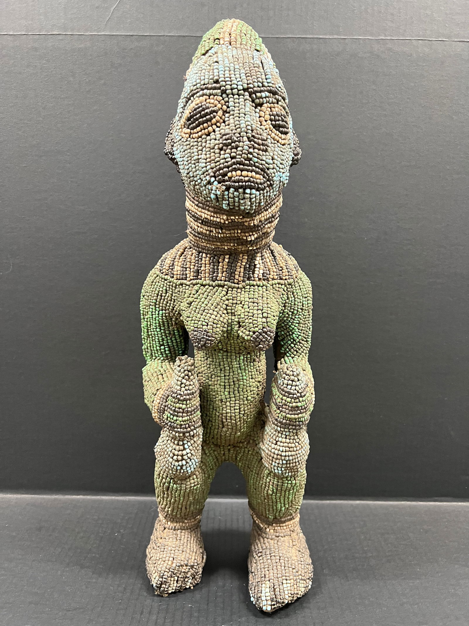 Bamileke Beaded Statue: African Tribal Art Carved Wood Bamileke Beaded Statue. The dimension is 23 inches high x 7 inches depth x 7.5 inches wide. Please be aware that some of the items are vintage, secondhand, old ages,