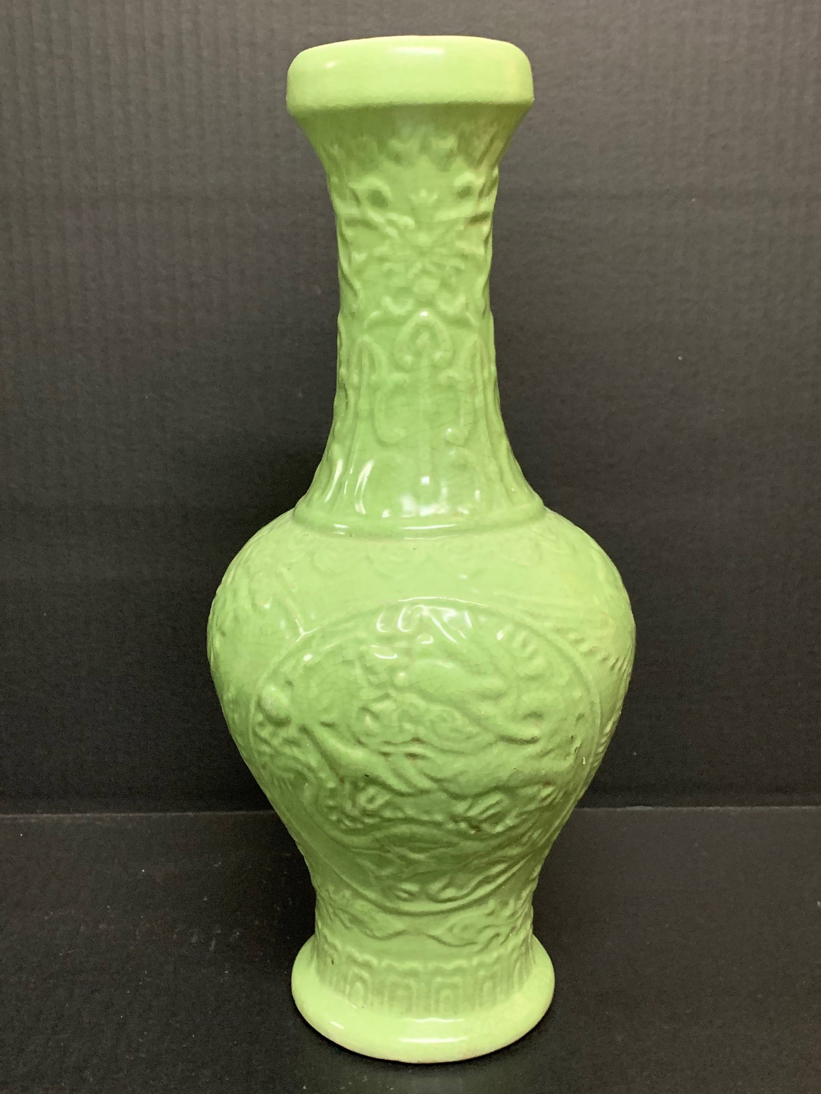 Porcelain Green Porcelain Vase: Chinese Art Porcelain Celadon Green Vase with Raised Floral Design. The dimension is 13.5 inches high x 5 inches wide. Please be aware that some of the items are vintage, secondhand, old ages,