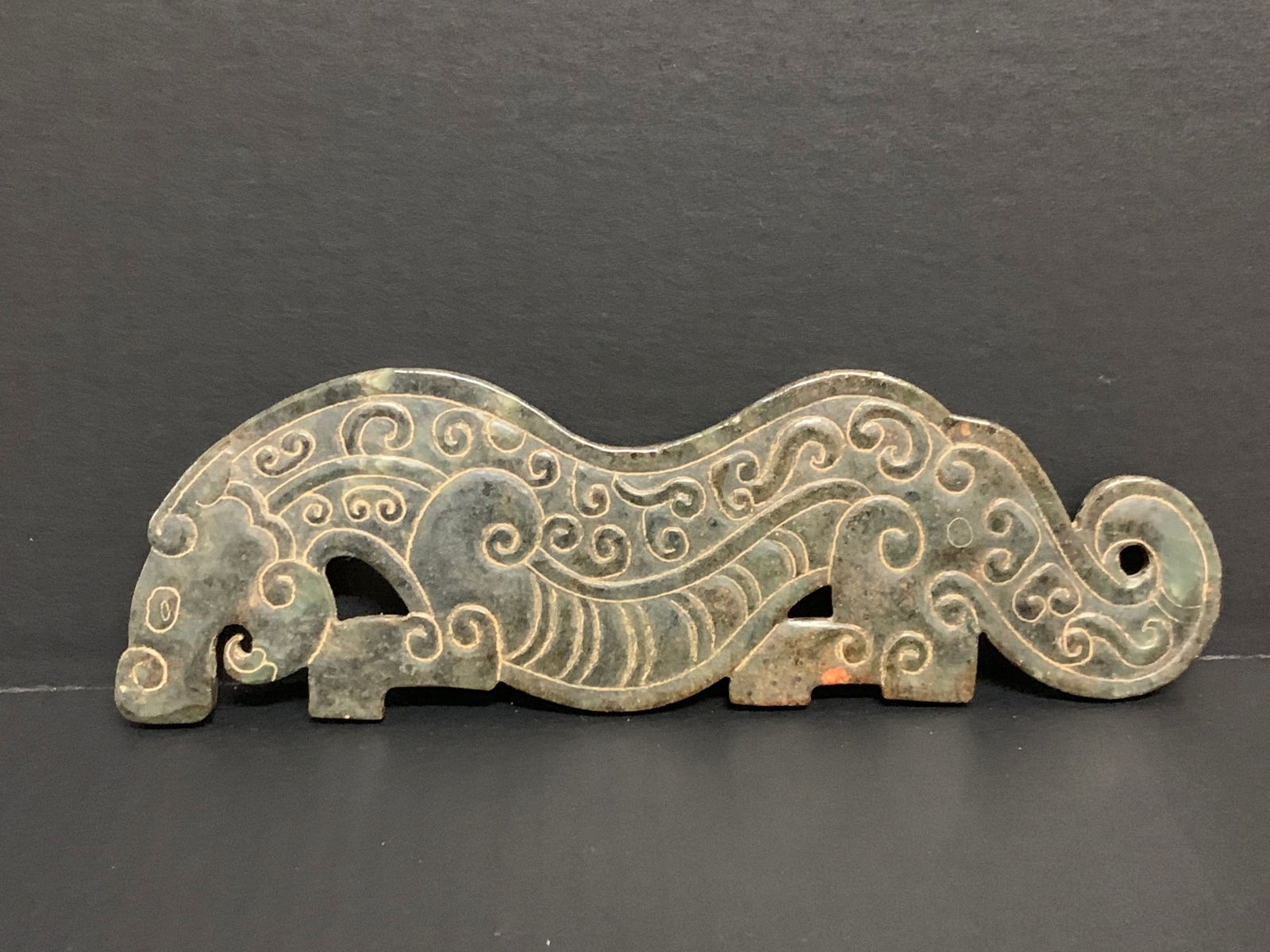 Carved Hetian Jade Dragon Plaque Sculpture: Chinese Art Carved Hetian Jade Dragon Plaque Sculpture. The dimension is 3.5 inches high x 10 inches wide. Please be aware that some of the items are vintage, secondhand, old ages, antiques and may ha