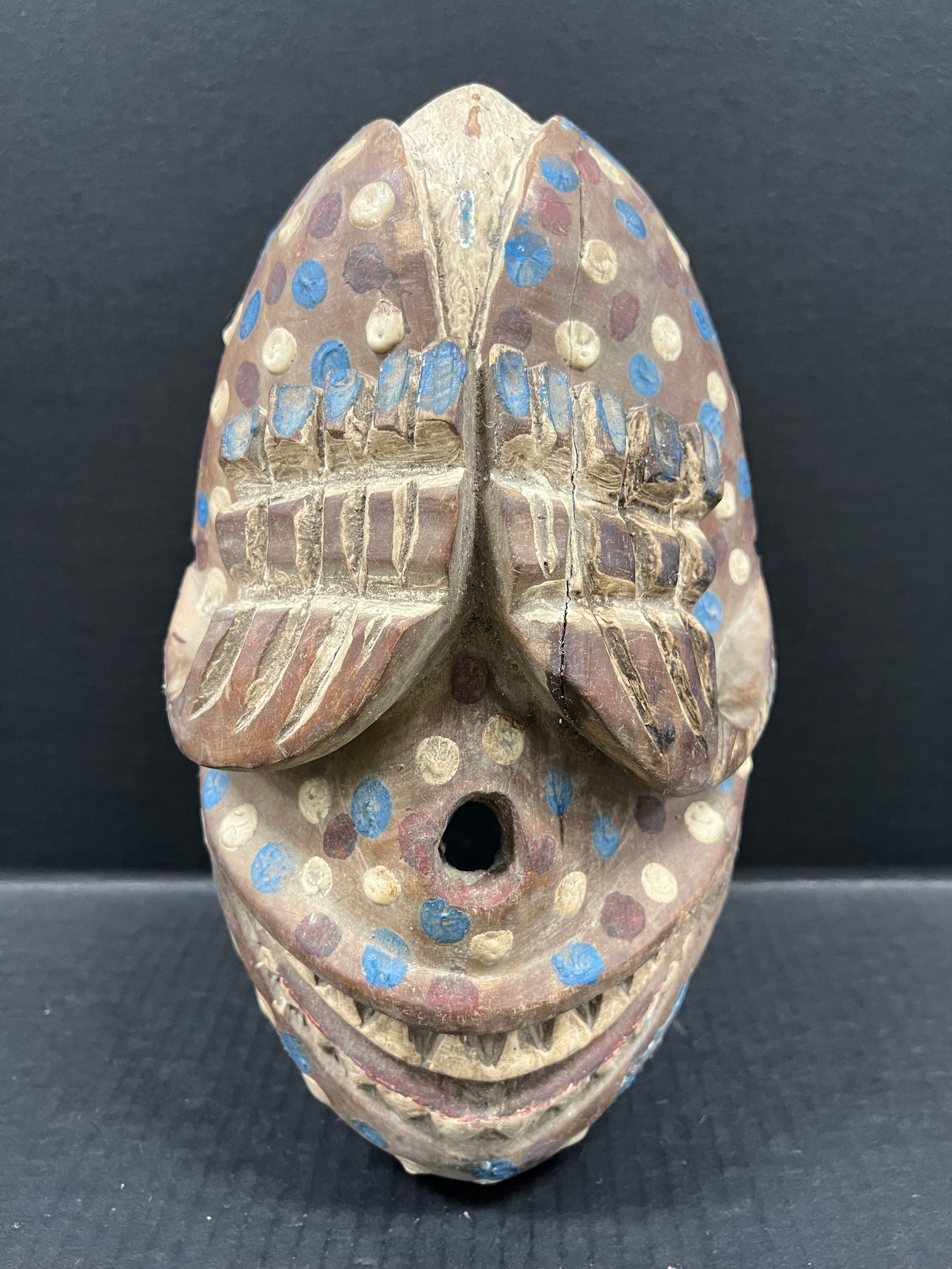 Bozo Leopard Mask: African Tribal Art Carved Wood Bozo Leopard Mask. The dimension is 12.5 inches high x 7.5 inches wide. Please be aware that some of the items are vintage, secondhand, old ages, antiques and may have