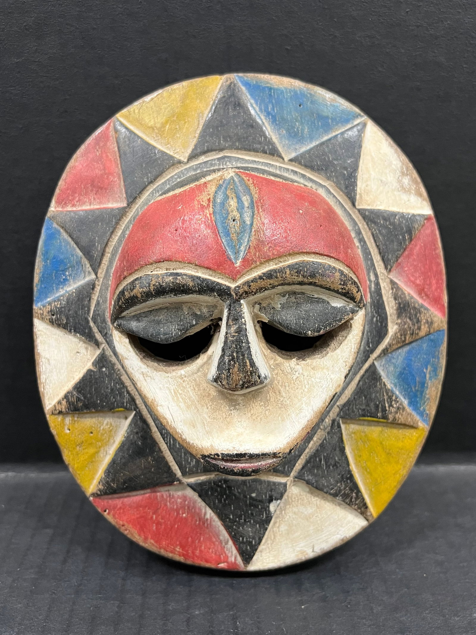 Eket Mask: African Tribal Art Carved Wood Eket Mask. The dimension is 7.25 inches high x 6.25 inches wide. Please be aware that some of the items are vintage, secondhand, old ages, antiques and may have a