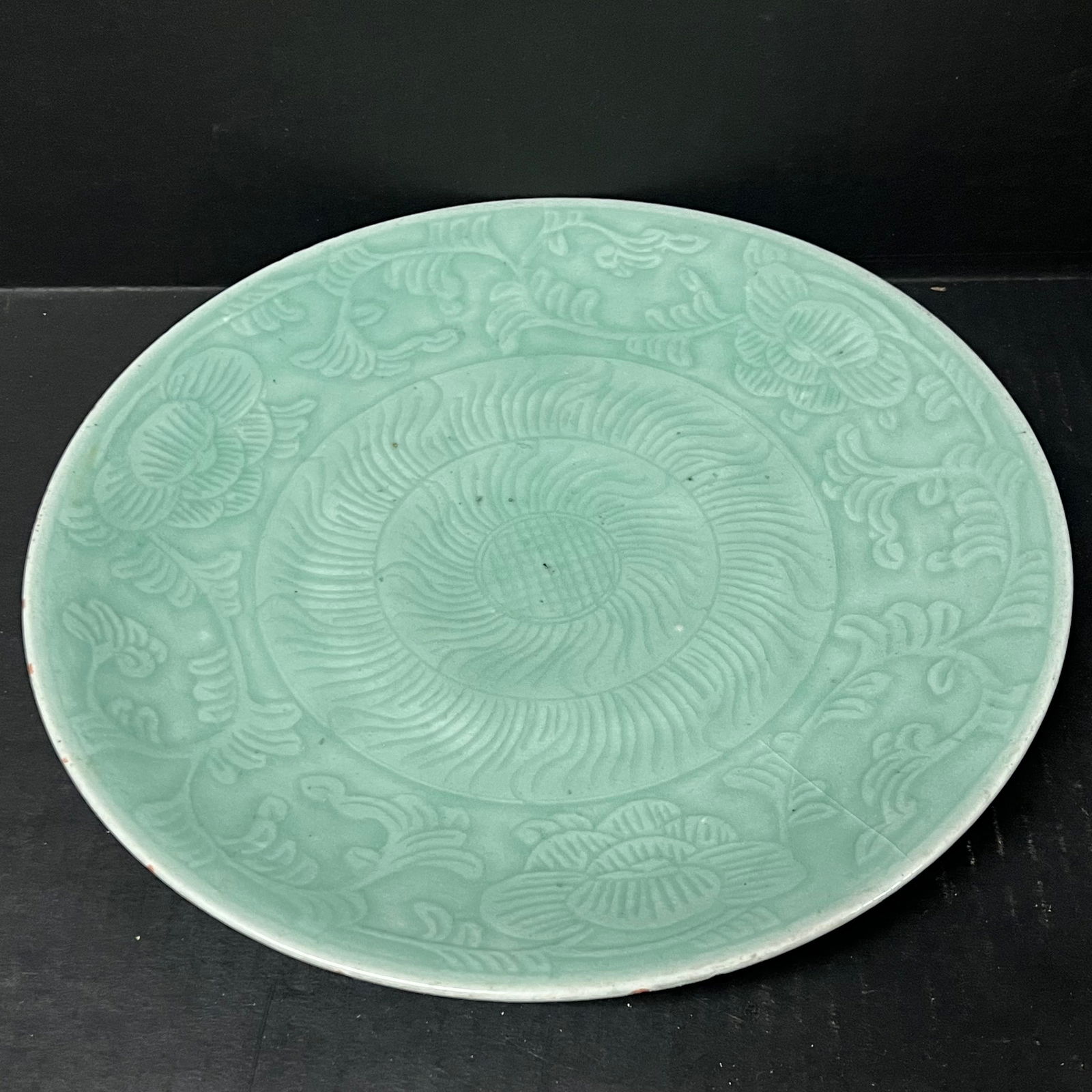 Porcelain Celadon Plate: Chinese Art Porcelain Celadon Plate. The dimension is 11.5 inches high x 11.5 inches wide. Please be aware that some of the items are vintage, secondhand, old ages, antiques and may have a defects or