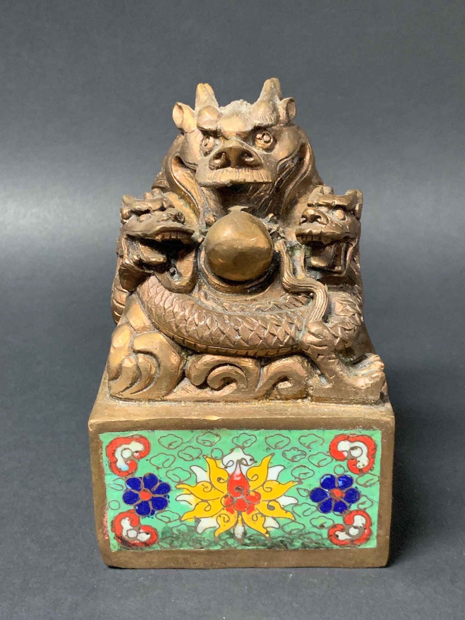 Bronze And Cloisonne Seal With Floral and Dragon Design: Chinese Art Bronze and Cloisonne Sea with Floral and Dragon Design. The dimension is 5.5 inches high x 3.5 inches wide. Please be aware that some of the items are vintage, secondhand, old ages,
