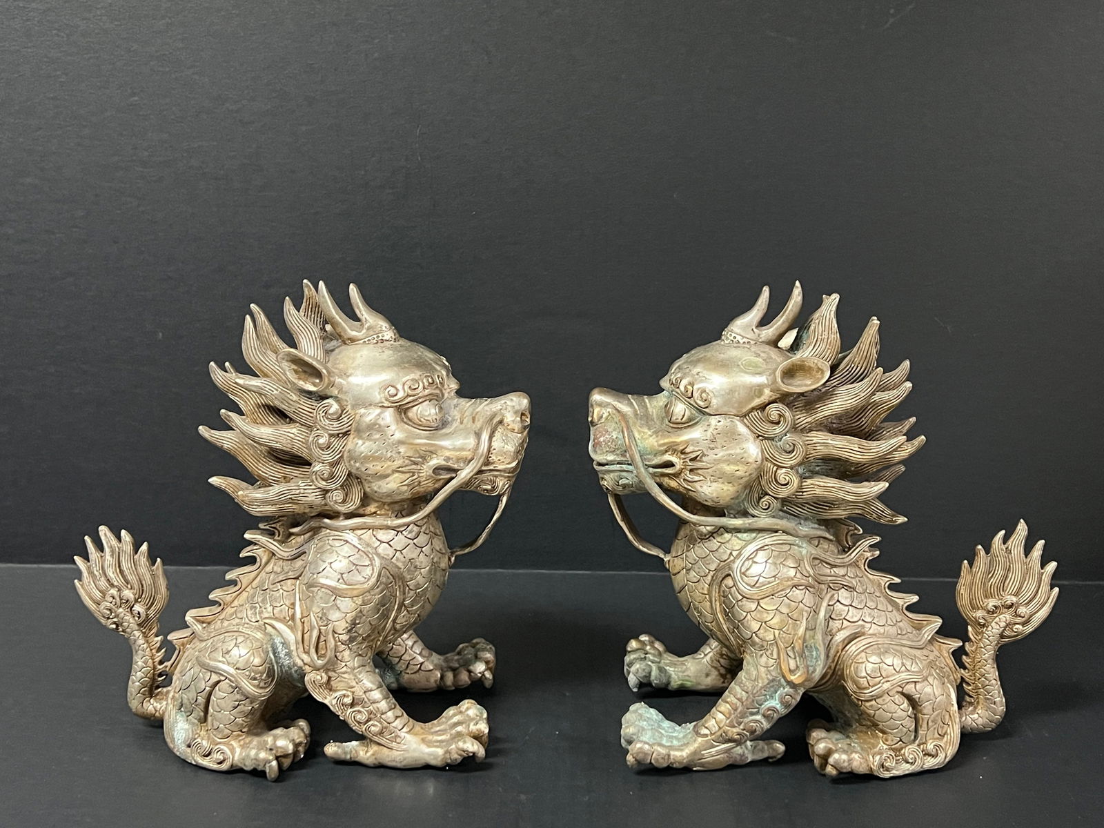 Pair of Silver Gilt Bronze Metal Kylin Dog Sculpture: Chinese Art Pair of Silver Gilt Bronze Metal Kylin Dog Sculpture. The dimension is 9 inches high x 4.5 inches depth x 8 inches wide. Please be aware that some of the items are vintage, secondhand, old