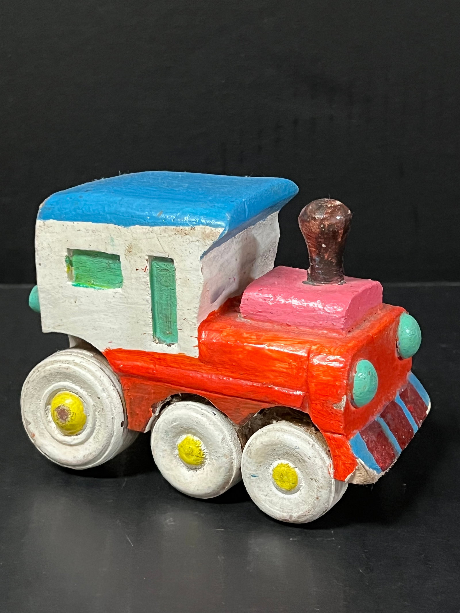 Carved Wood Toy Car: Folk Art Carved Wood Papermache Mold of Toy Car. The dimension is 3.5 inches high x 4.75 inches wide. Please be aware that some of the items are vintage, secondhand, old ages, antiques and may have a