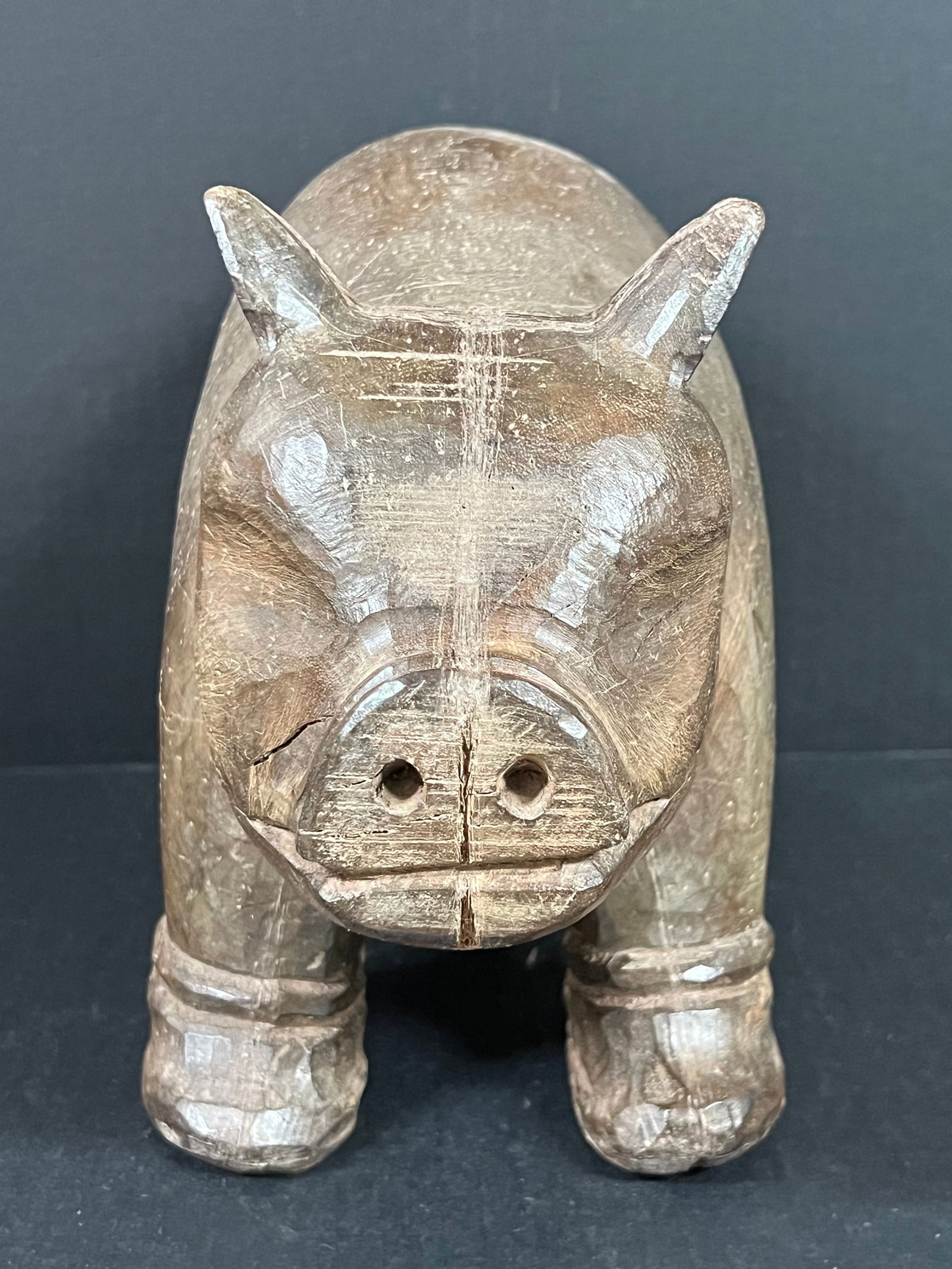 Carved Wood Pig: Folk Art Carved Wood Papermache Mold of Pig. The dimension is 8 inches high x 12 inches wide. Please be aware that some of the items are vintage, secondhand, old ages, antiques and may have a defects