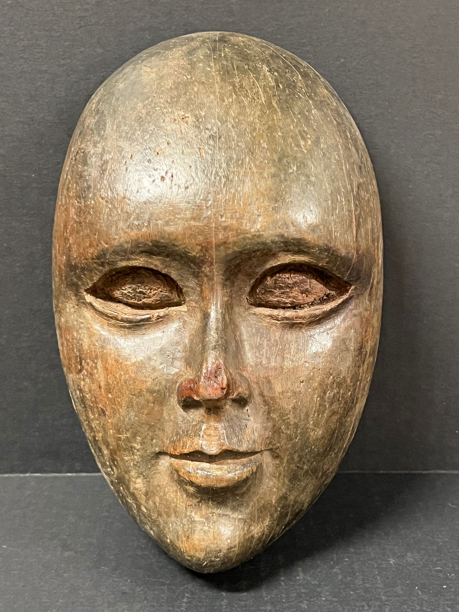 Carved Wood Male Face: Folk Art Carved Wood Papermache Mold of Male Face. The dimension is 9 inches high x 6 inches wide. Please be aware that some of the items are vintage, secondhand, old ages, antiques and may have a