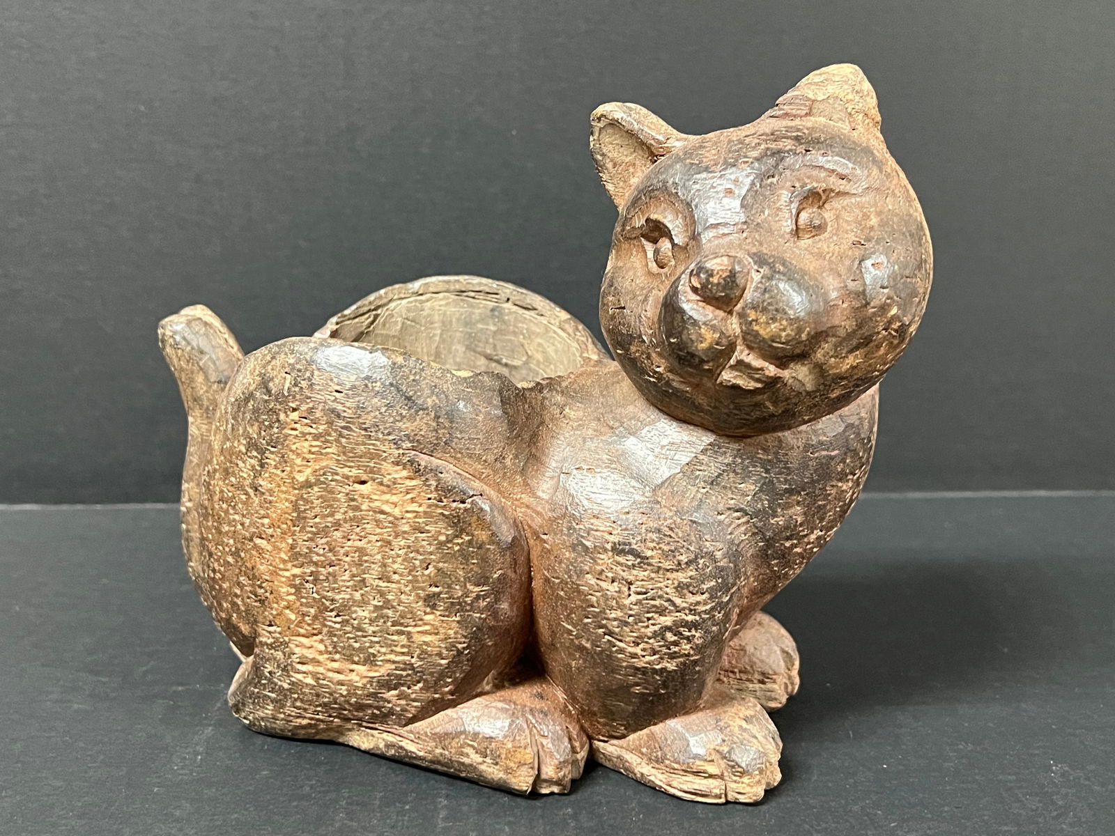 Carved Wood Cat Container: Folk Art Carved Wood Papermache Mold of Cat Container. The dimension is 7.25 inches high x 4.5 inches depth x 8.5 inches wide. Please be aware that some of the items are vintage, secondhand, old