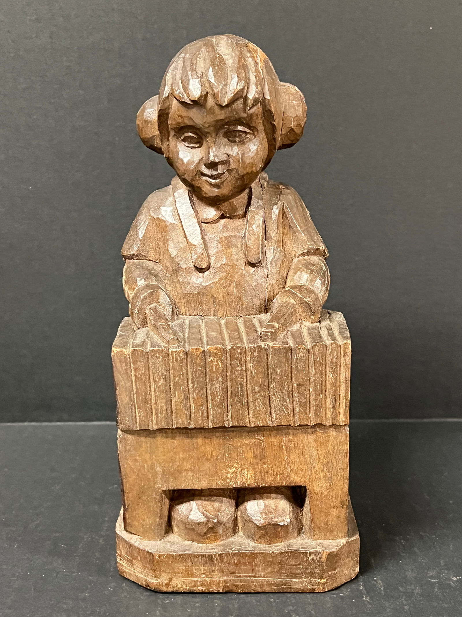 Carved Wood Boy: Folk Art Carved Wood Papermache Mold of Boy. The dimension is 9.5 inches high x 4.25 inches depth x 4.25 inches wide. Please be aware that some of the items are vintage, secondhand, old ages,