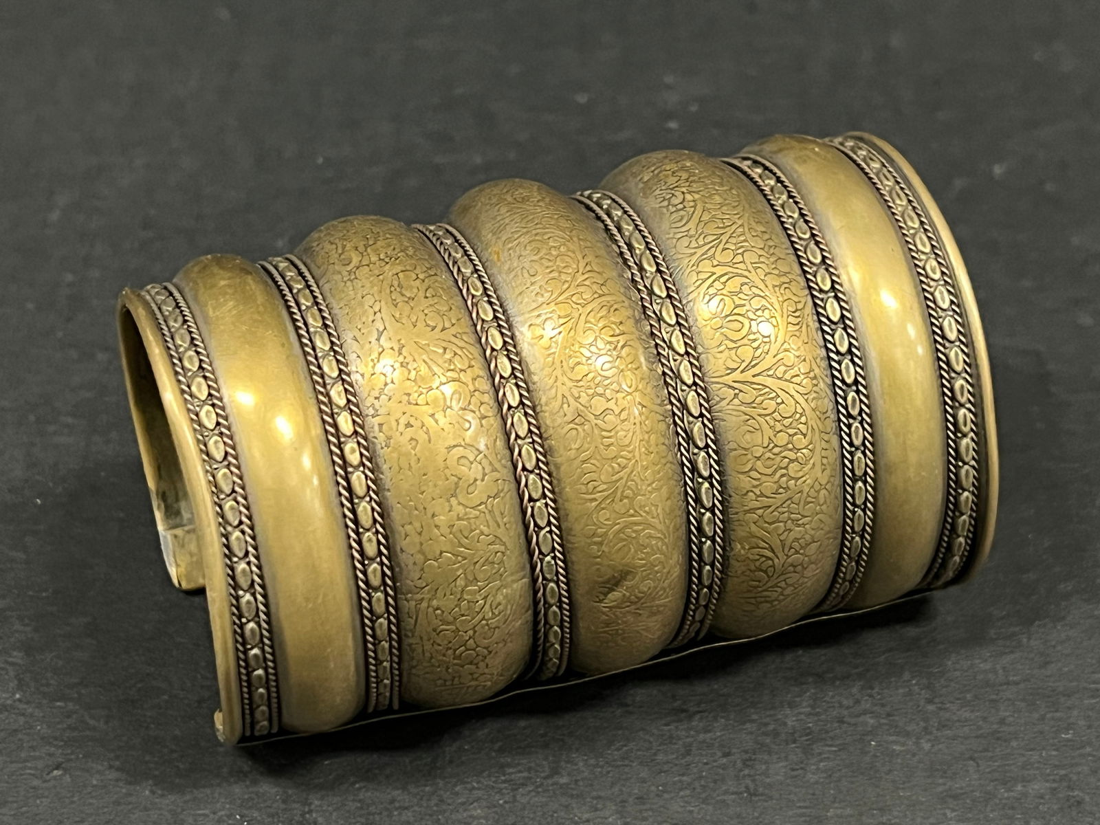 Philippine Islamic Art Elongated Copper Cuff Bracelet: Philippine Islamic Art Elongated Copper Cuff Bracelet. The dimension is 4 inches high x 2.5 inches wide. Please be aware that some of the items are vintage, secondhand, old ages, antiques and may have