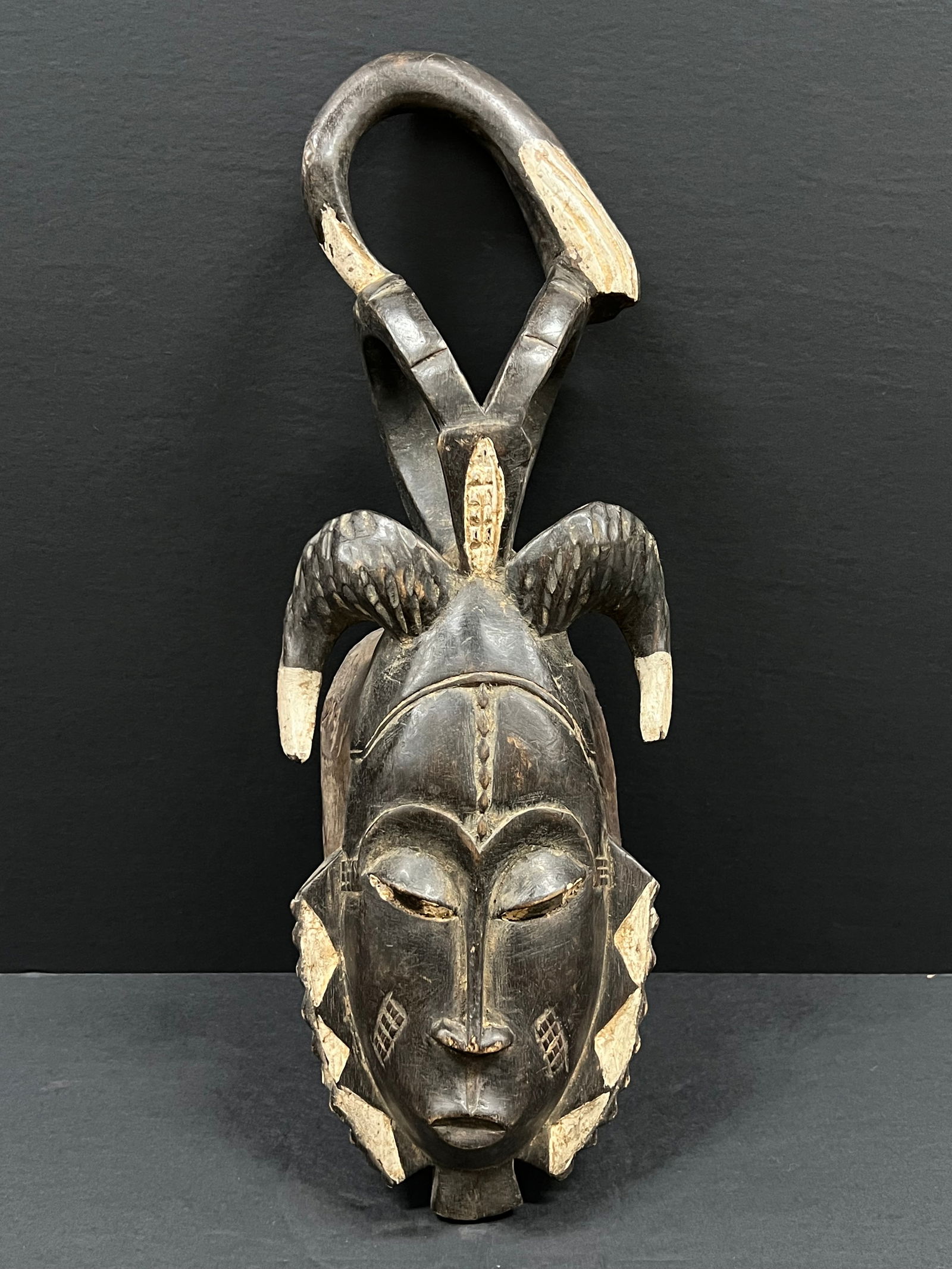 Baule Mask: African Tribal Art Kuba Mask. The dimension is 15 inches high x 6 inches wide. Please be aware that some of the items are vintage, secondhand, old ages, antiques and may have a defects or sign of