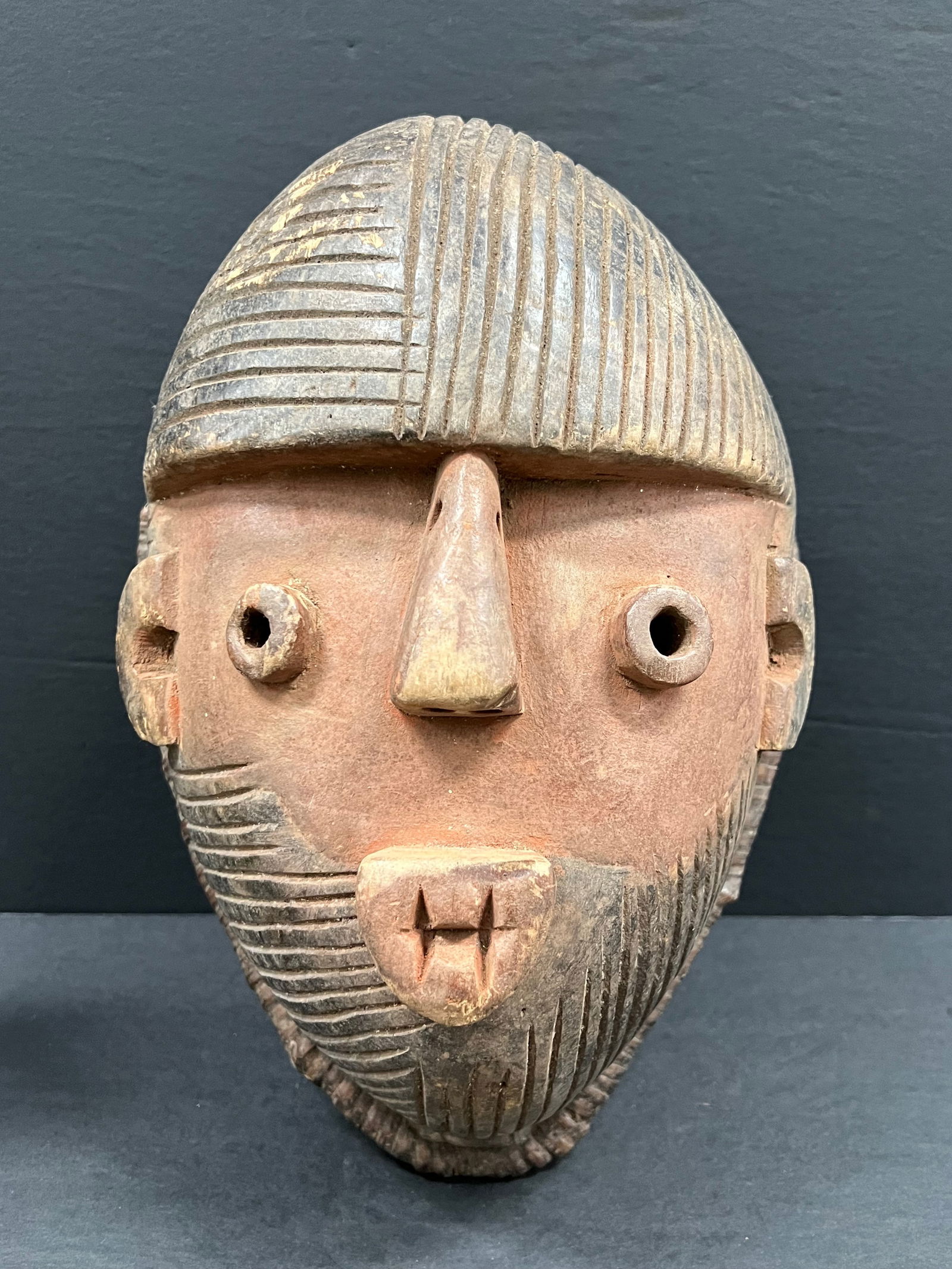 Tabwa Mask: African Tribal Art Carved Wood Tabwa Mask. The dimension is 13.5 inches high x 9.5 inches wide. Please be aware that some of the items are vintage, secondhand, old ages, antiques and may have a