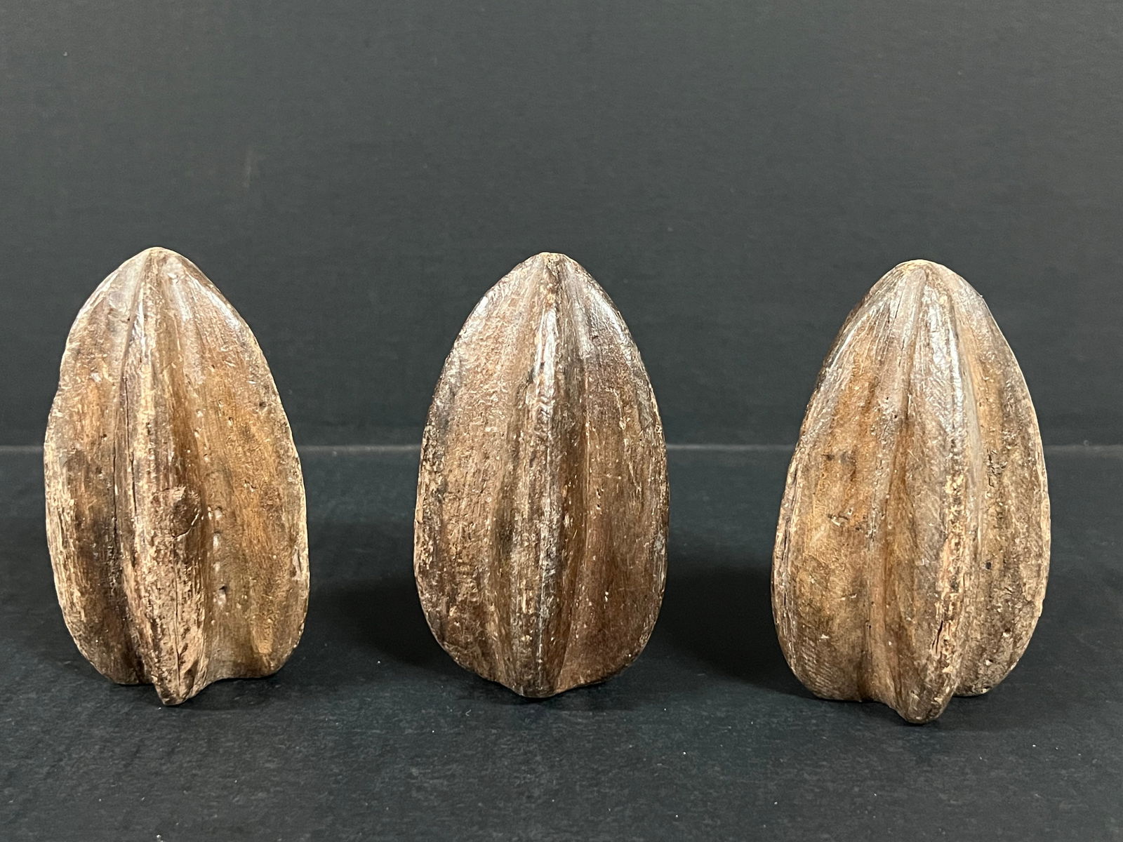 Carved Wood Starfruit set of 3: Folk Art Carved Wood Papermache Mold of Starfruit. The dimension is 4.25 inches high x 2.5 inches wide. Please be aware that some of the items are vintage, secondhand, old ages, antiques and may have