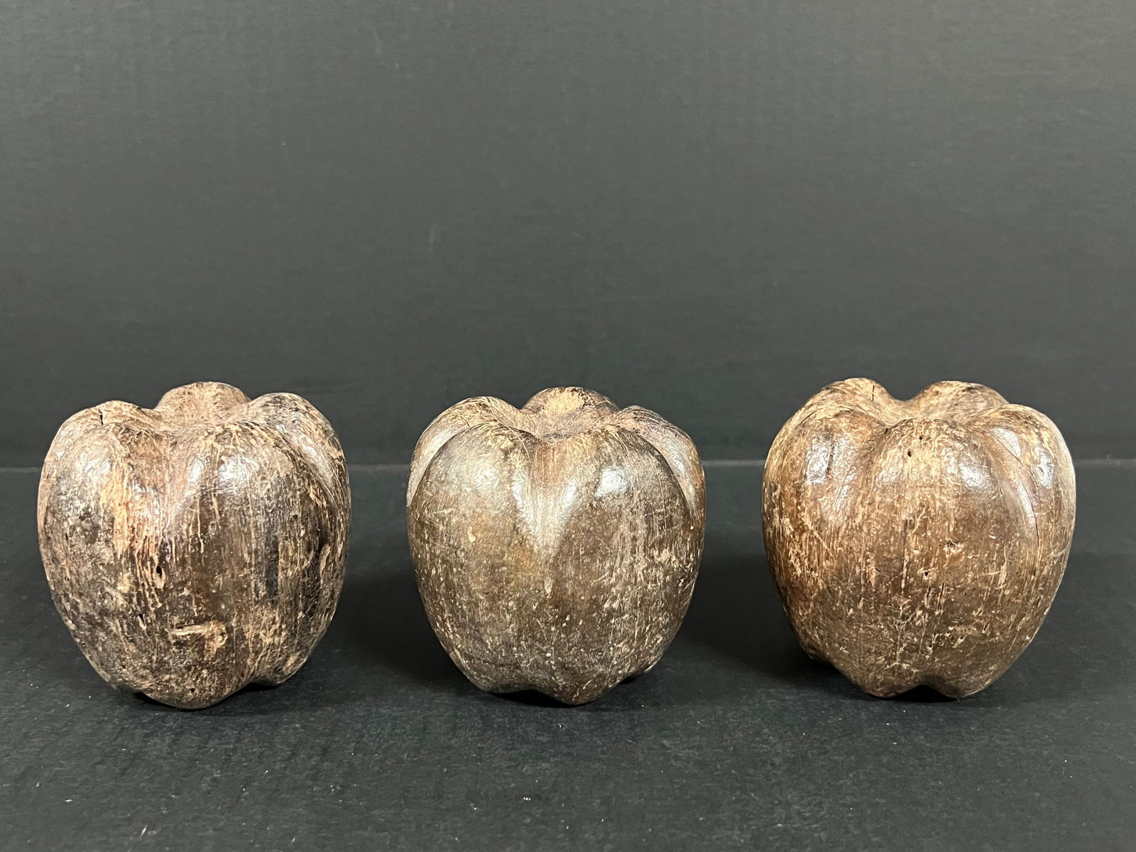 Carved Wood Apple set of 3: Folk Art Carved Wood Papermache Mold of Apple. The dimension is 3.25 inches high x 3 inches wide. Please be aware that some of the items are vintage, secondhand, old ages, antiques and may have a