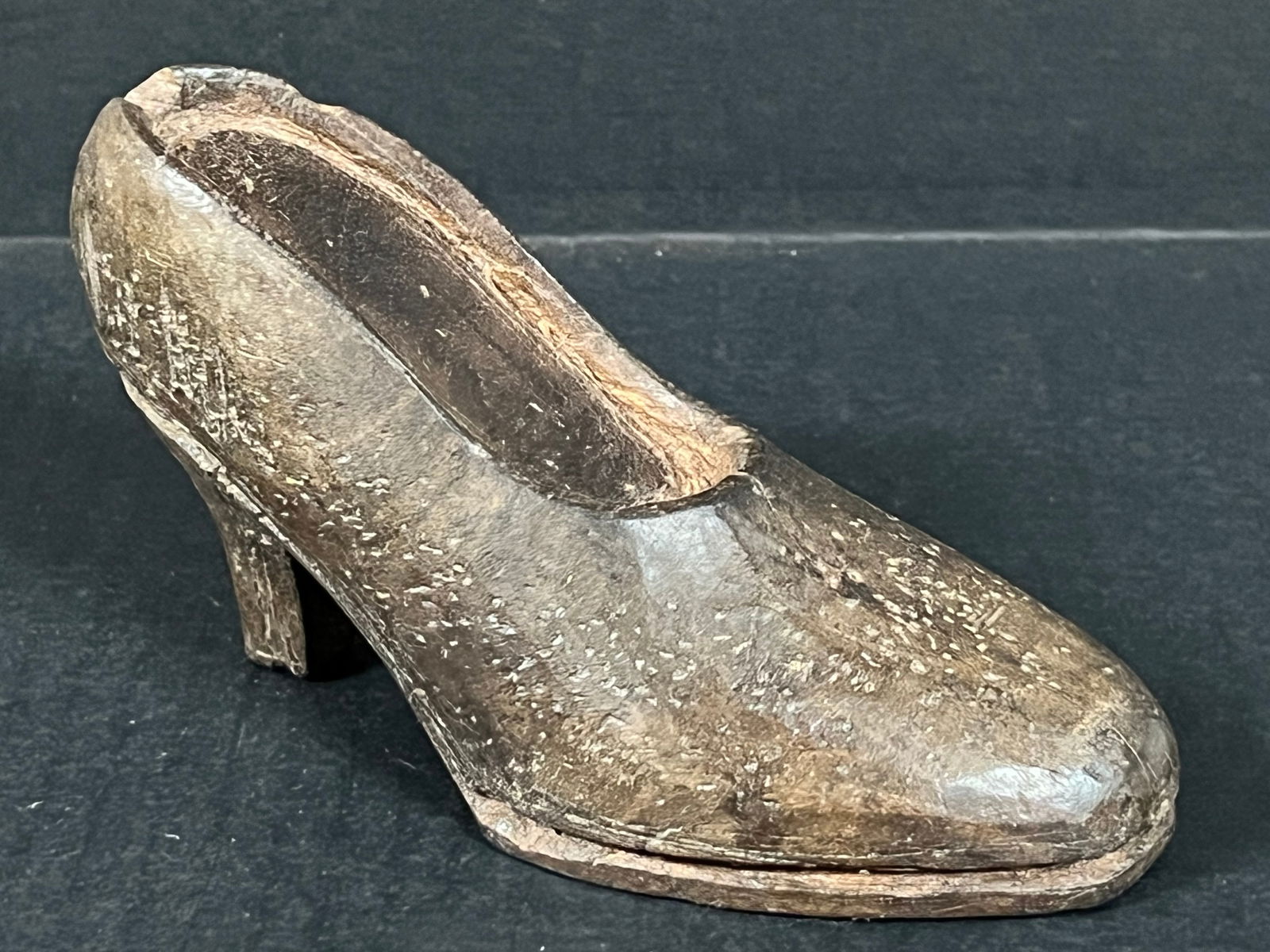 Carved Wood Shoe: Folk Art Carved Wood Papermache Mold of Shoe. The dimension is 3.5 inches high x 6.5 inches wide. Please be aware that some of the items are vintage, secondhand, old ages, antiques and may have a