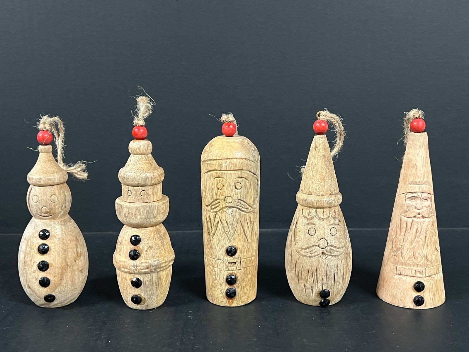 Carved Wood Christmas Ornaments set of 5: Folk Art Carved Wood Papermache Mold of Christmas Ornaments. The dimension is 5.75 inches high x 2 inches wide. Please be aware that some of the items are vintage, secondhand, old ages, antiques and m