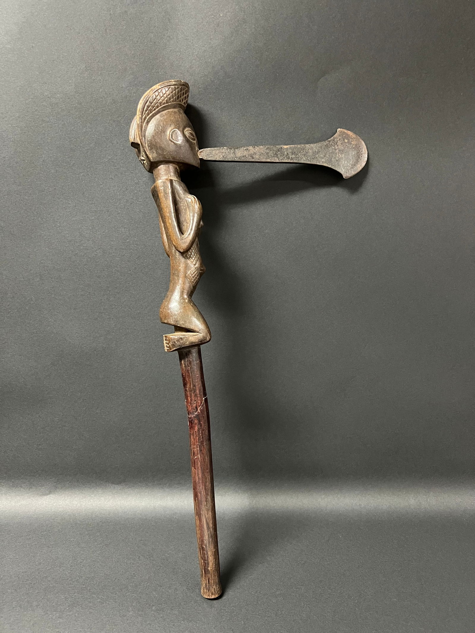Chokwe Ax: African Tribal Art Chokwe Ax. The dimension is 19 inches high x 9.25 inches wide. Please be aware that some of the items are vintage, secondhand, old ages, antiques and may have a defects or sign of