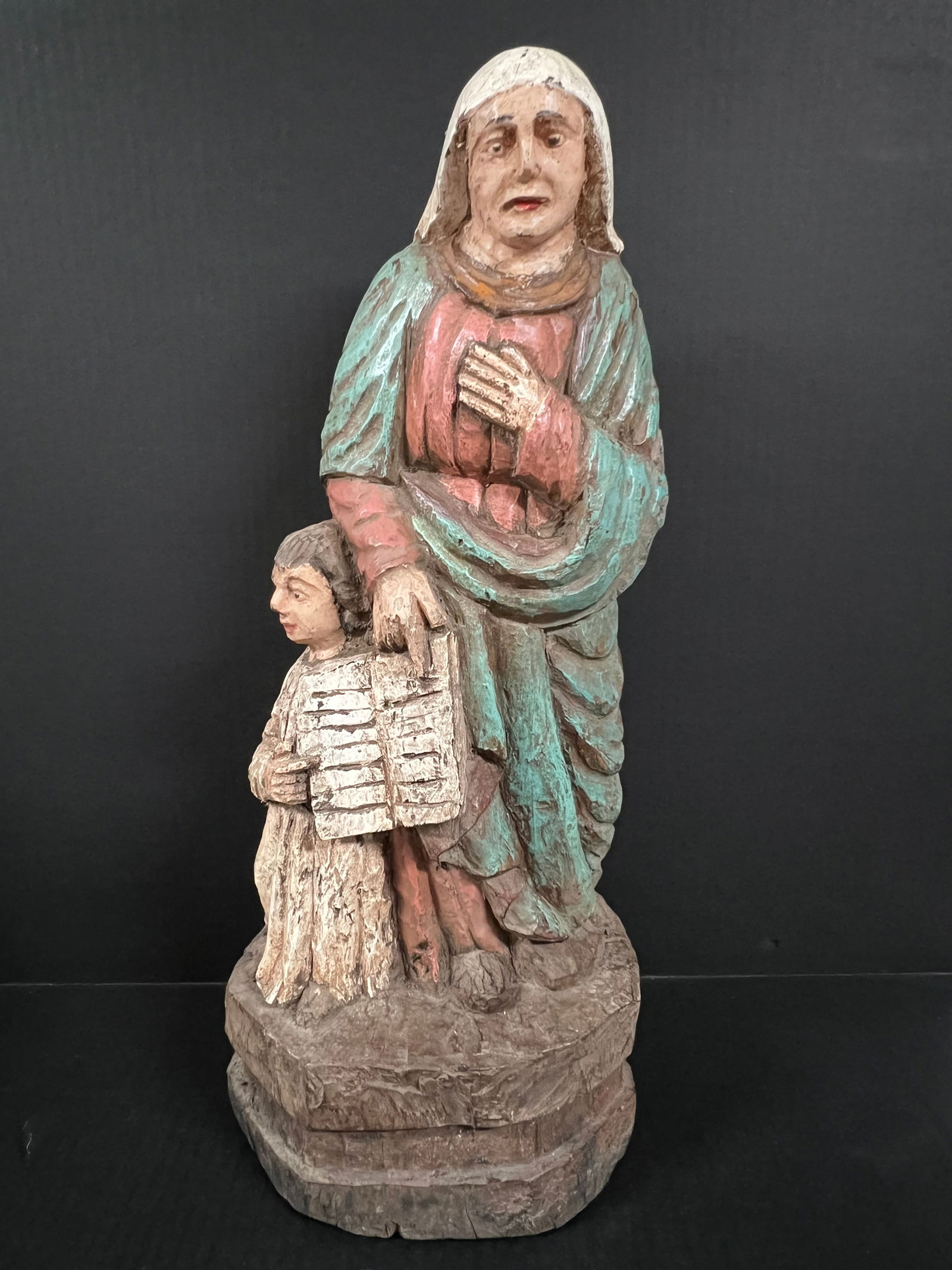 Carved Wood Saint Anne: Religious Art Carved Wood Saint Anne. The dimension is 21 inches high x 8 inches depth x 8.5 inches wide. Please be aware that some of the items are vintage, secondhand, old ages, antiques and may