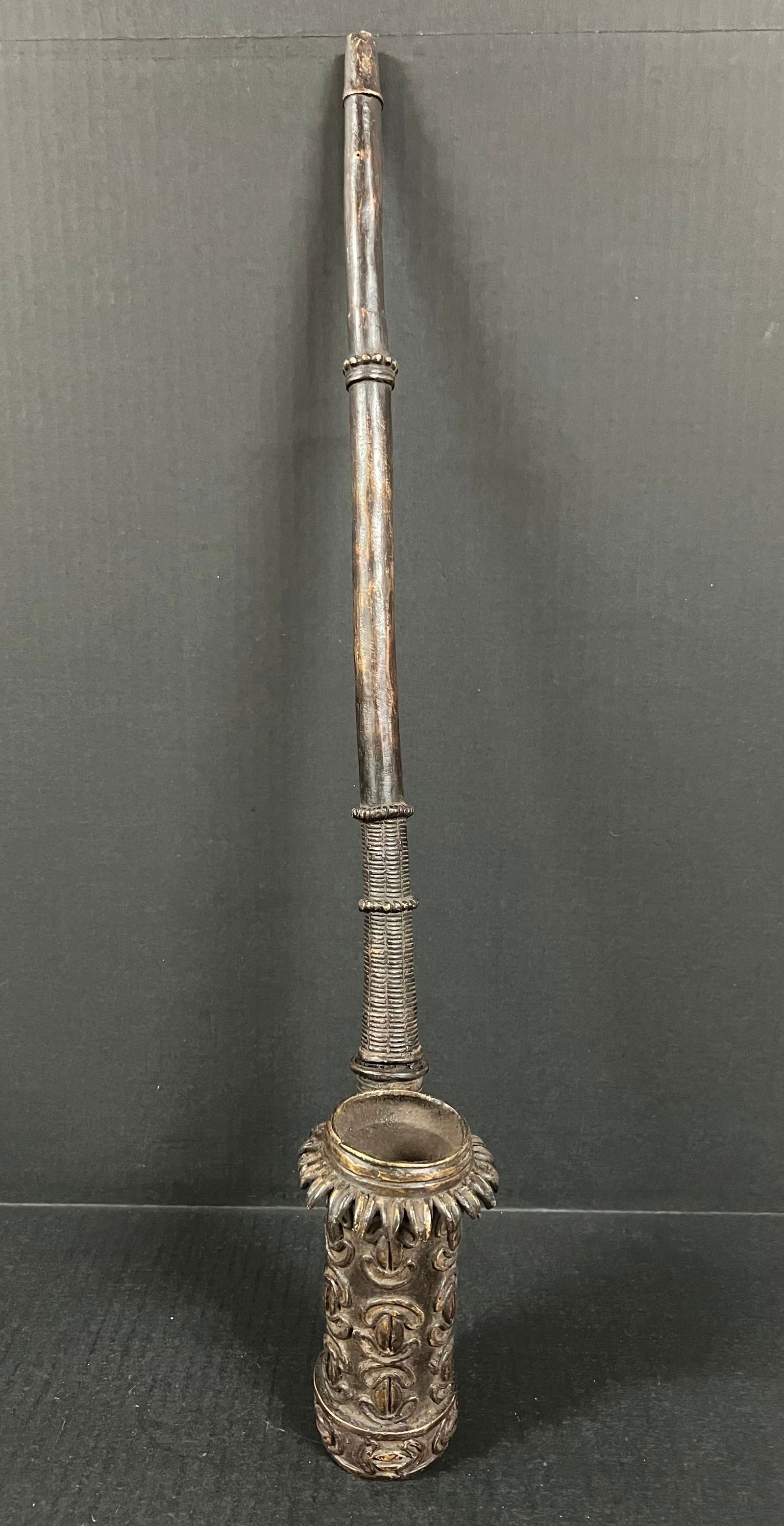 Bamun Bronze Smoking Pipe: African Tribal Art Bamun Bronze Smoking Pipe. The dimension is 25 inches high x 5 inches depth x 3.5 inches wide. Please be aware that some of the items are vintage, secondhand, old ages, antiques
