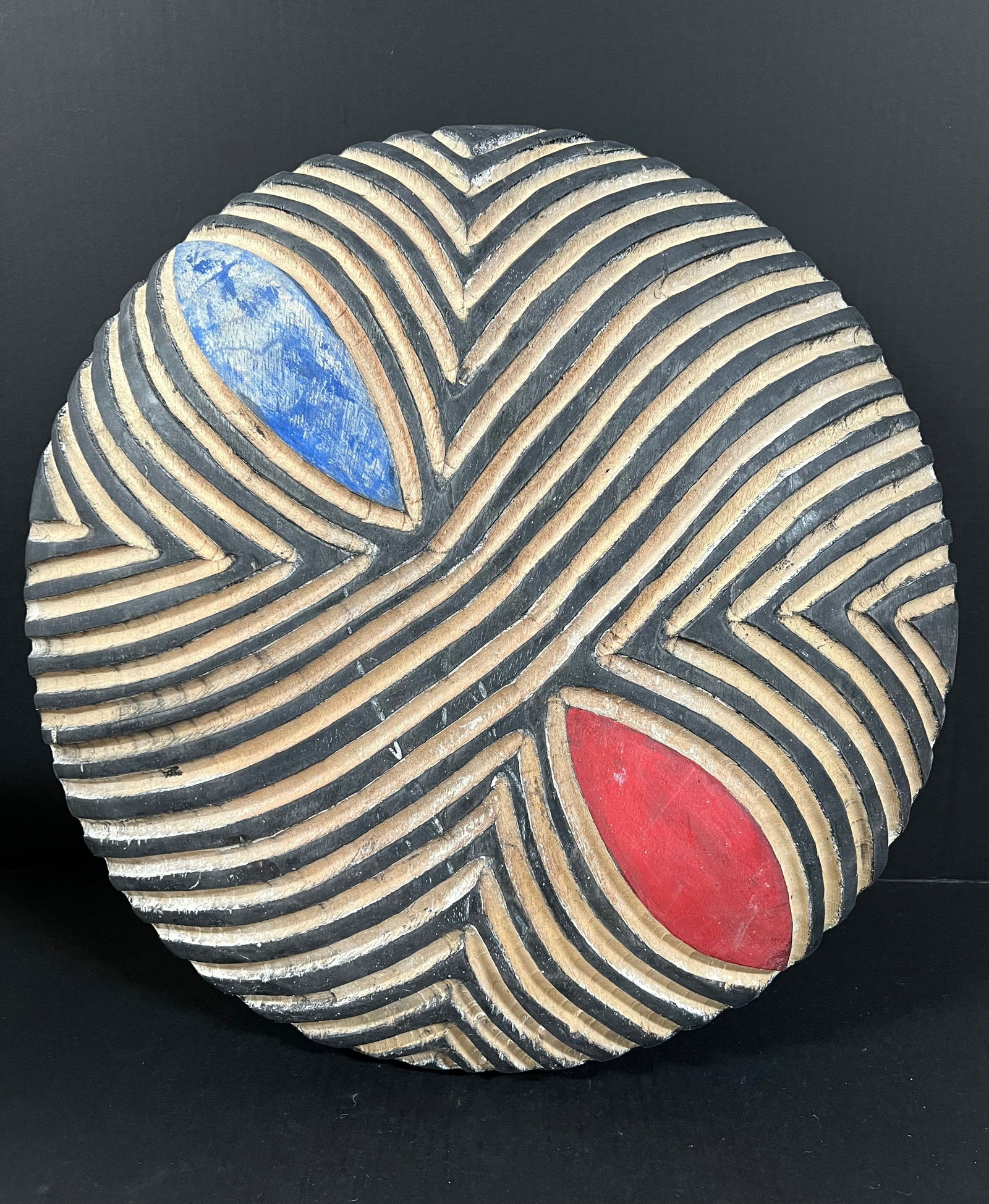 Zulu Shield: African Tribal Art Zulu Shield. The dimension is 20.5 inches high x 20.5 inches wide. Please be aware that some of the items are vintage, secondhand, old ages, antiques and may have a defects or sign