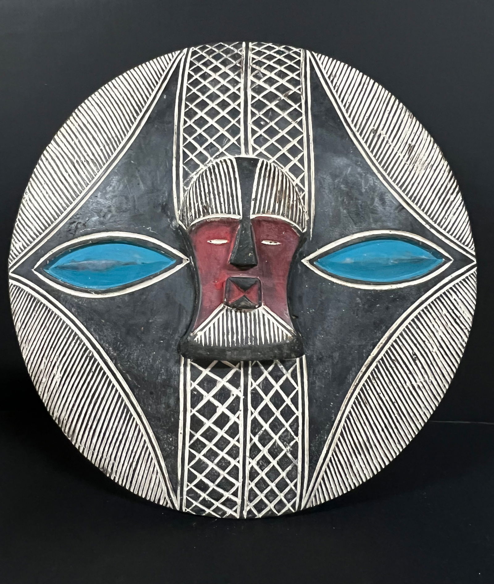 Songye Shield: African Tribal Art Songye Shield. The dimension is 22.5 inches high x 22 inches wide. Please be aware that some of the items are vintage, secondhand, old ages, antiques and may have a defects or sign