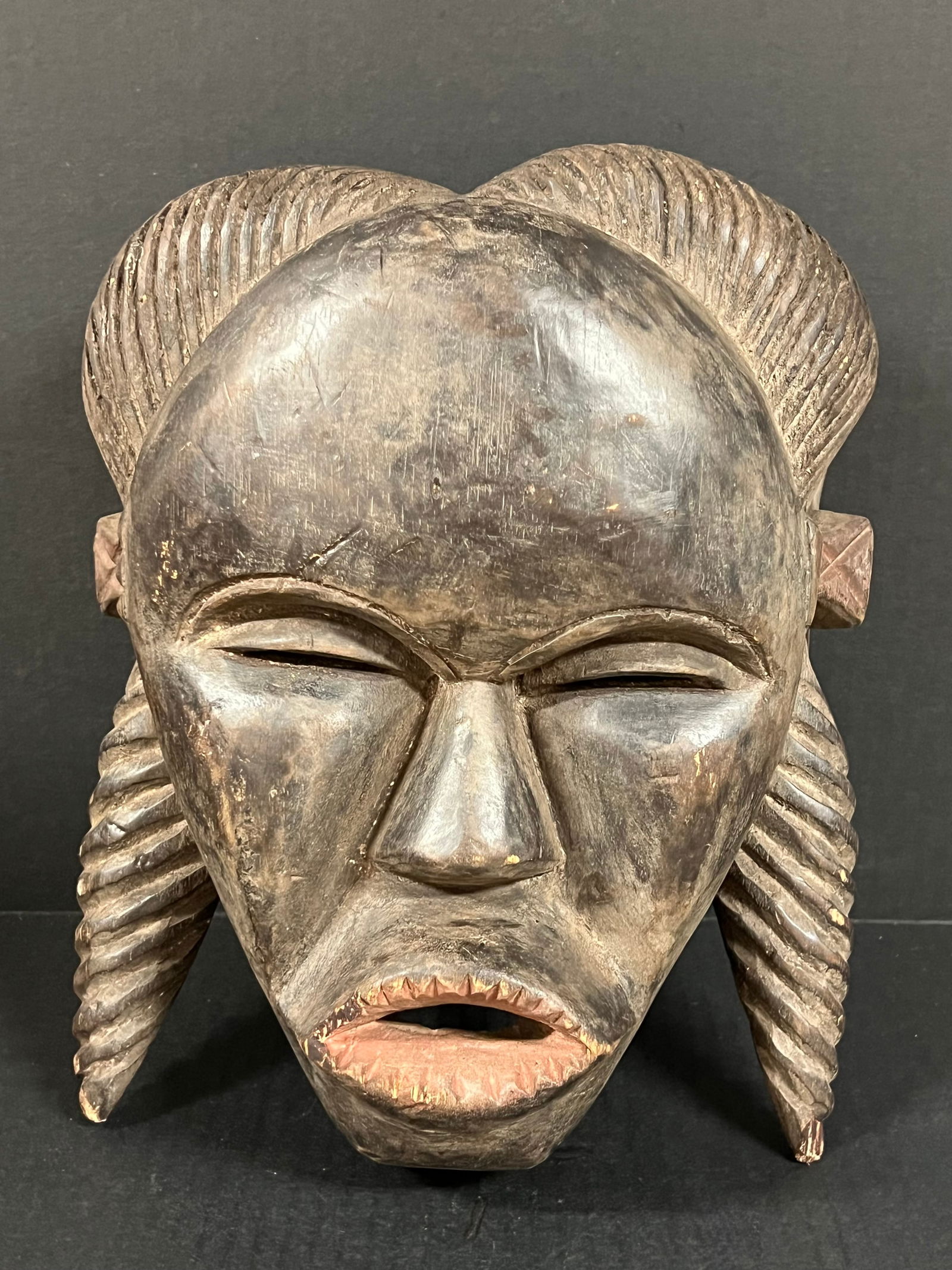 Makonde Mask: African Tribal Art Makonde Mask. The dimension is 12 inches high x 9.5 inches wide. Please be aware that some of the items are vintage, secondhand, old ages, antiques and may have a defects or sign of