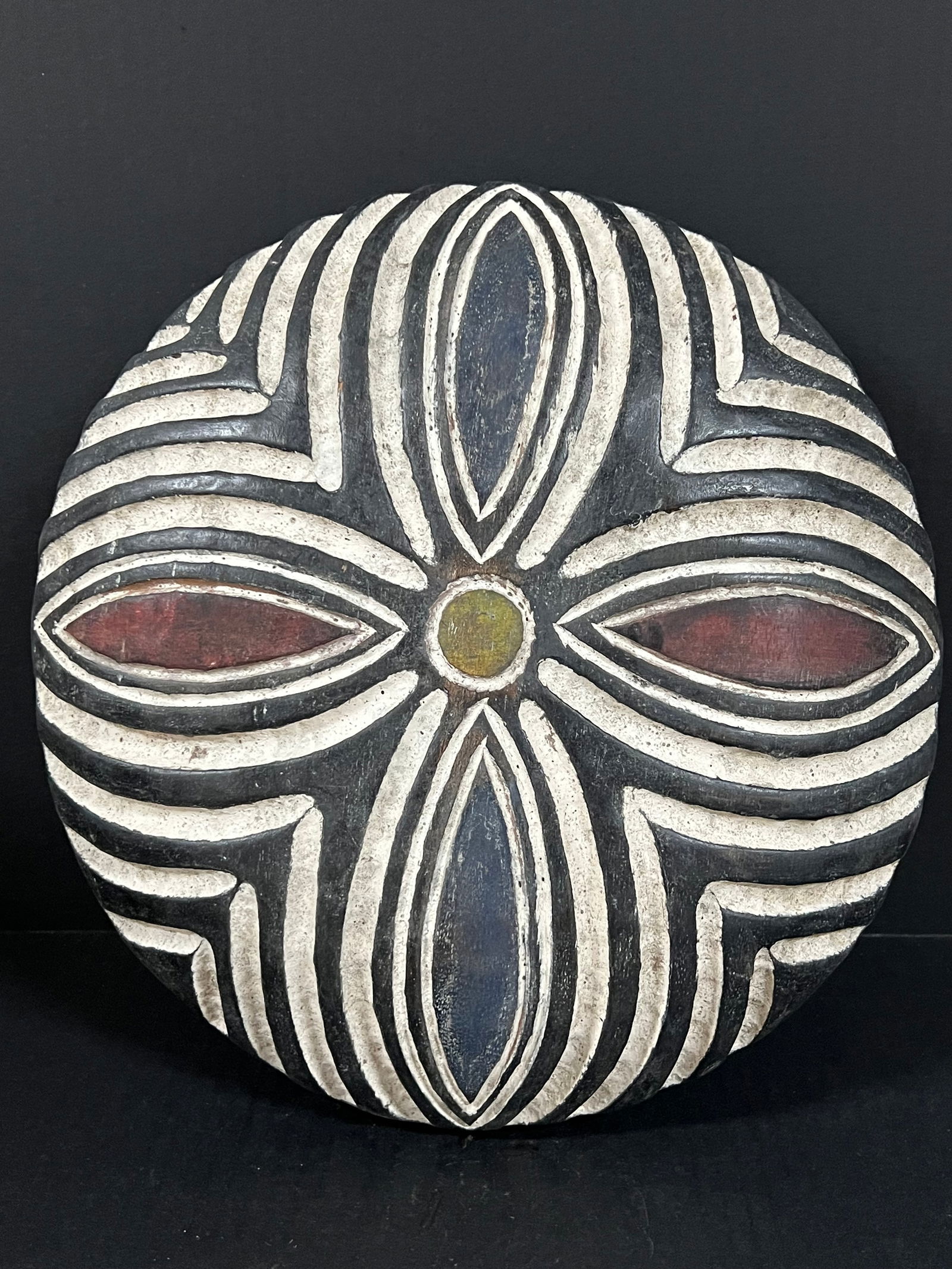 Zulu Shield: African Tribal Art Zulu Shield. The dimension is 13.5 inches high x 13.5 inches wide. Please be aware that some of the items are vintage, secondhand, old ages, antiques and may have a defects or sign