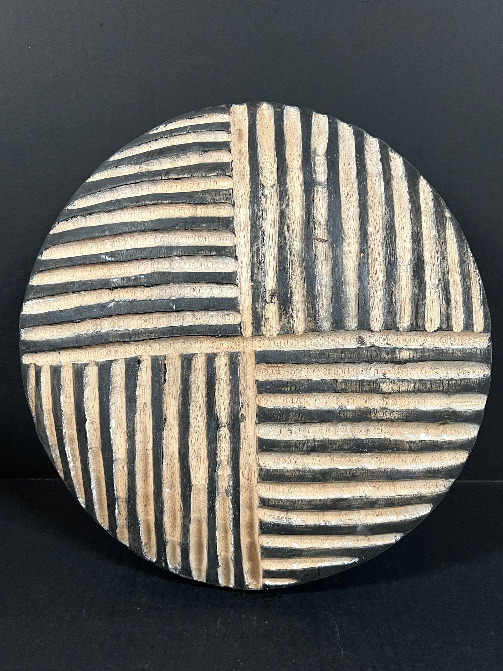 Zulu Shield: African Tribal Art Carved Wood Zulu Shield. The dimension is 13.5 inches high x 13.5 inches wide. Please be aware that some of the items are vintage, secondhand, old ages, antiques and may have a