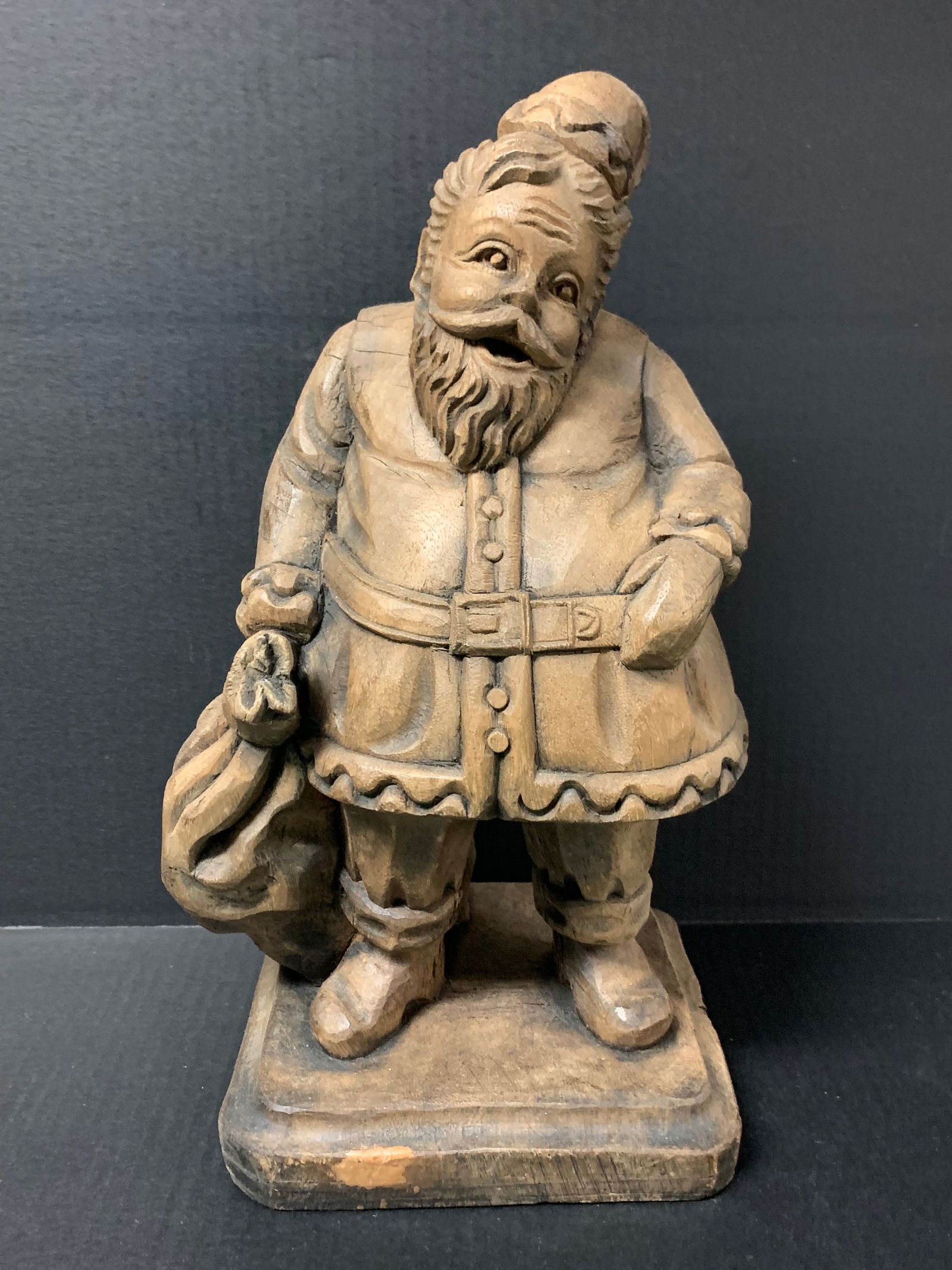 Carved Wood Santa Claus Sculpture: Folk Art Carved Wood Santa Claus Sculpture. The dimension is 16 inches high x 9 inches wide. Please be aware that some of the items are vintage, secondhand, old ages, antiques and may have a defects