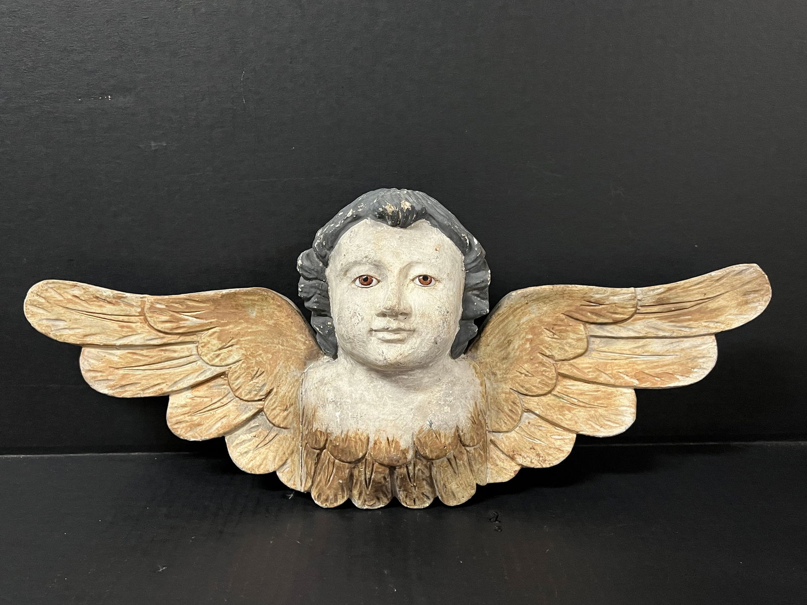 Carved Wood Cherub with Long Wings and Glass Eyes: Religious Art Carved Wood Cherub with Long Wings and Glass Eyes. The dimension is 8.5 inches high x 20 inches wide. Please be aware that some of the items are vintage, secondhand, old ages, antiques