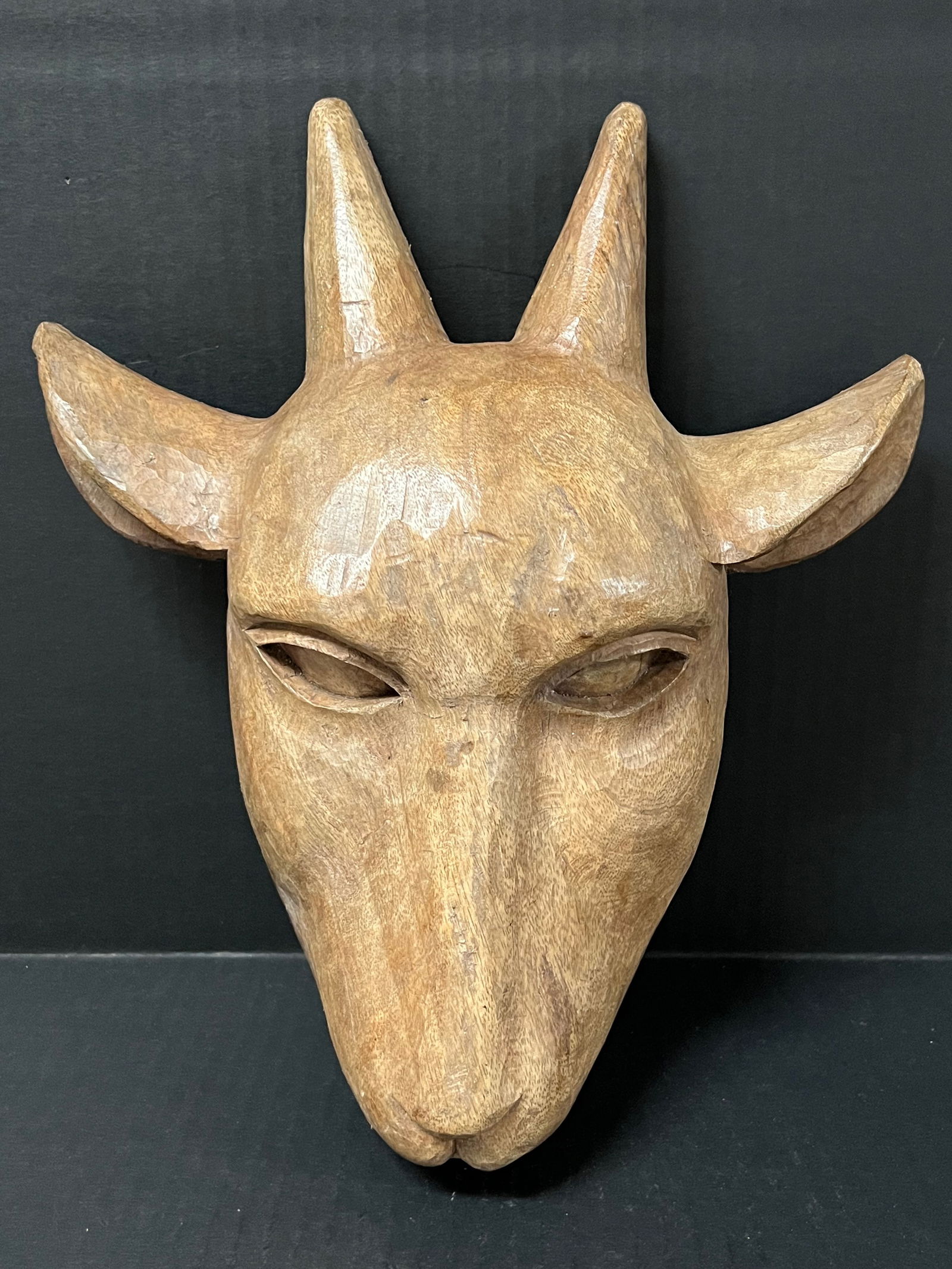 Carved Wood Goat Head Wall Plaque Sculpture: Folk Art Carved Wood Goat Head Wall Plaque Sculpture. The dimension is 12 inches high x 10.5 inches wide. Please be aware that some of the items are vintage, secondhand, old ages, antiques and may