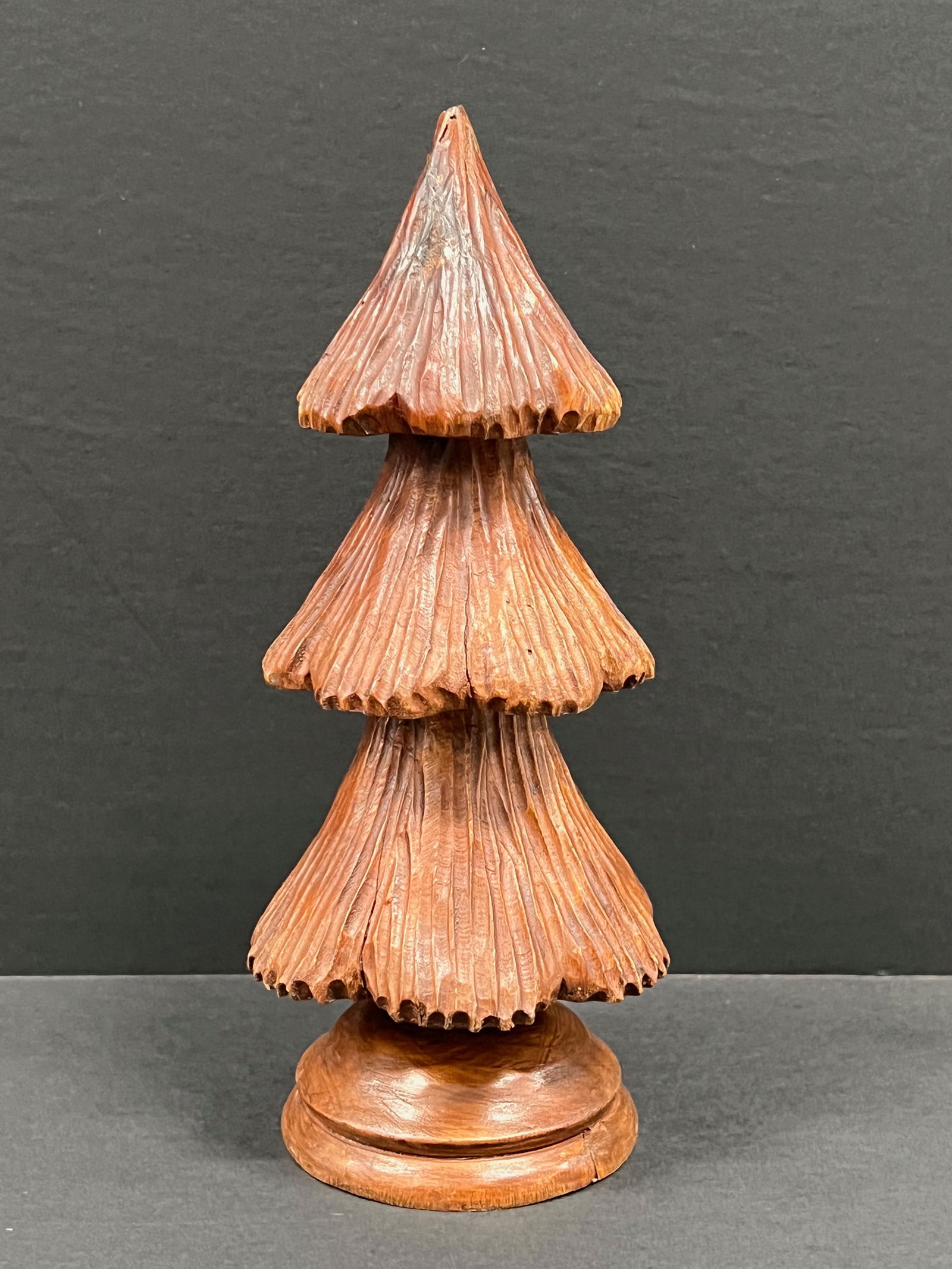 Carved Wood Christmas Tree Sculpture: Folk Art Carved Wood Christmas Tree Sculpture. The dimension is 9.5 inches high x 4 inches wide. Please be aware that some of the items are vintage, secondhand, old ages, antiques and may have a defec