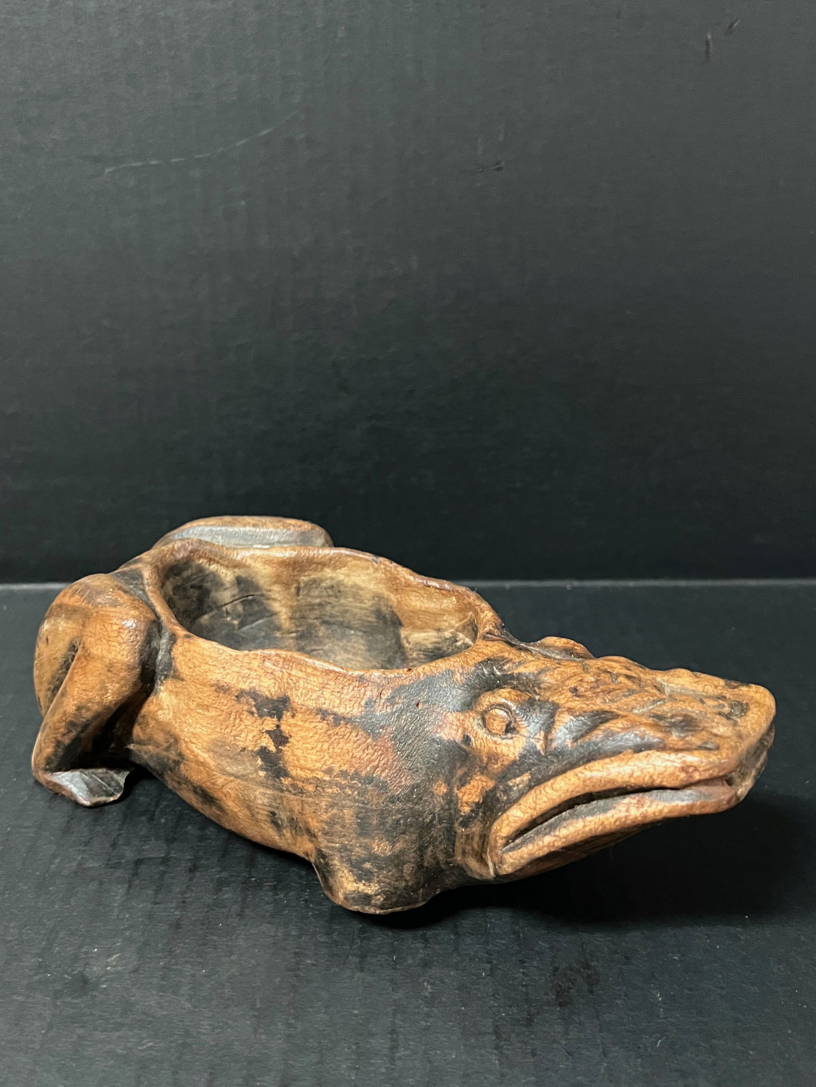 Carved Wood Frog Sculpture: Folk Art Carved Wood Frog Sculpture. The dimension is 3 inches high x 9 inches wide. Please be aware that some of the items are vintage, secondhand, old ages, antiques and may have a defects or sign o