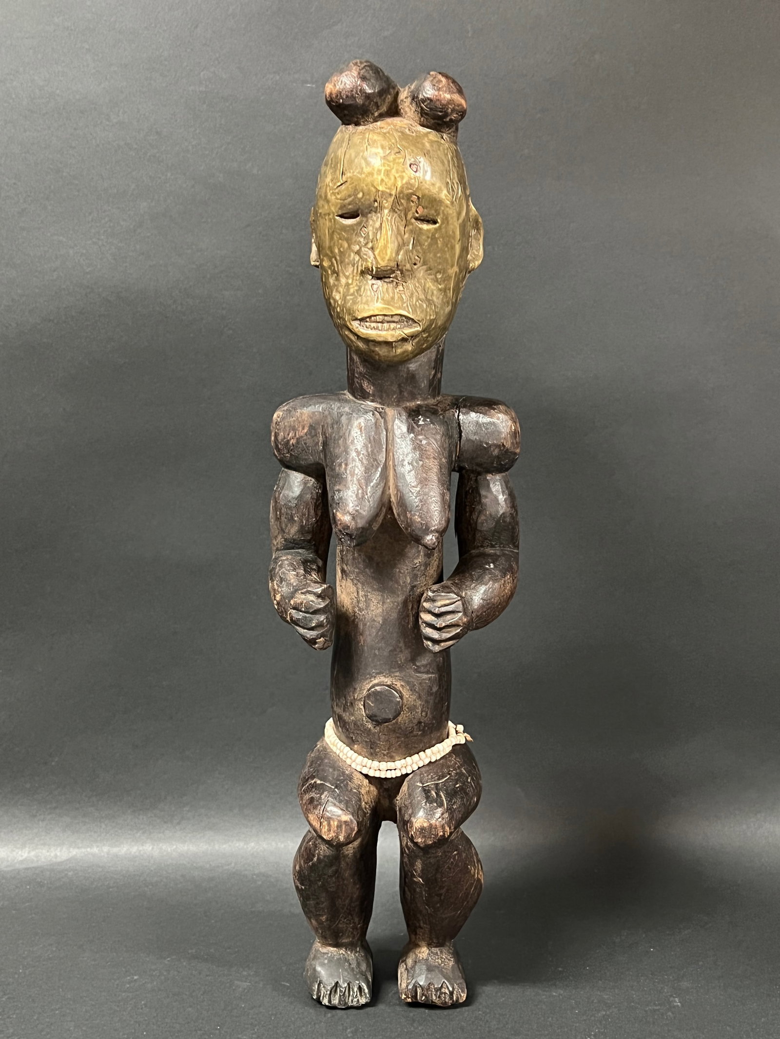 Fang Statue: African Tribal Art Fang Statue. The dimension is 20 inches high x 5.5 inches wide. Please be aware that some of the items are vintage, secondhand, old ages, antiques and may have a defects or sign of