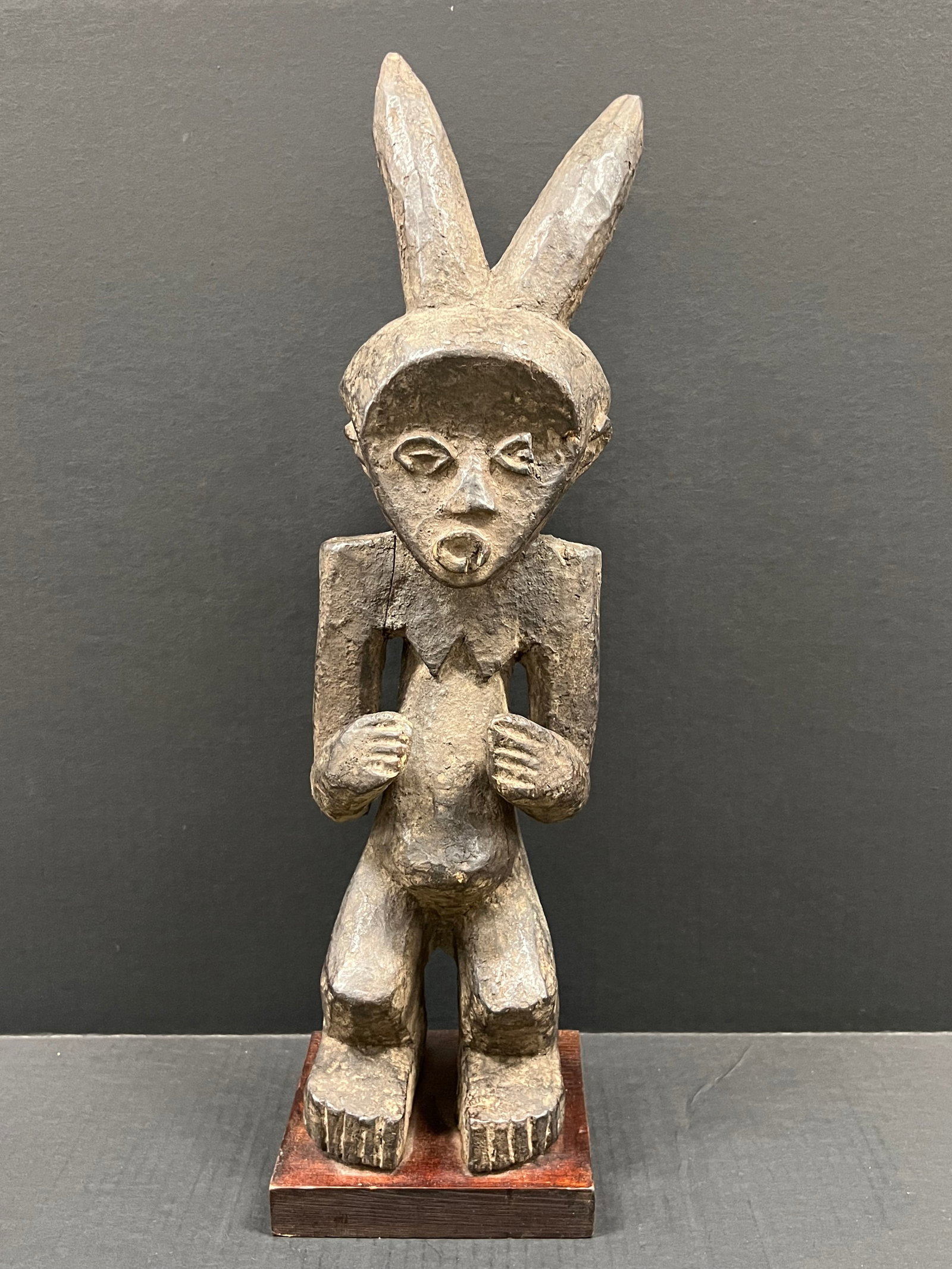 Mambilla Statue: African Tribal Art Mambilla Statue. The dimension is 22 inches high x 5.5 inches wide. Please be aware that some of the items are vintage, secondhand, old ages, antiques and may have a defects or sign