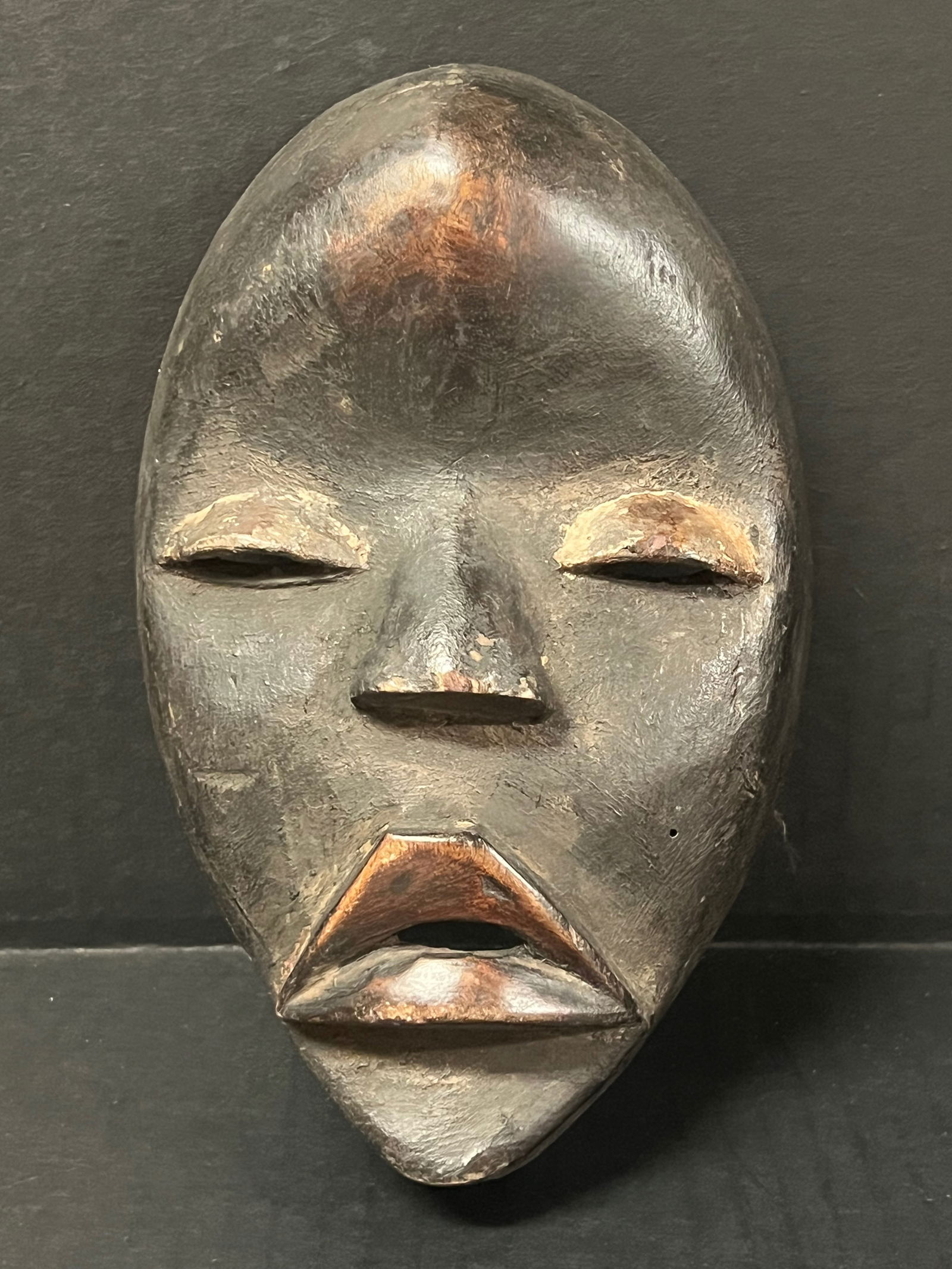 Dan Mask: African Tribal Art Dan Mask. The dimension is 8 inches high x 5 inches wide. Please be aware that some of the items are vintage, secondhand, old ages, antiques and may have a defects or sign of ages,