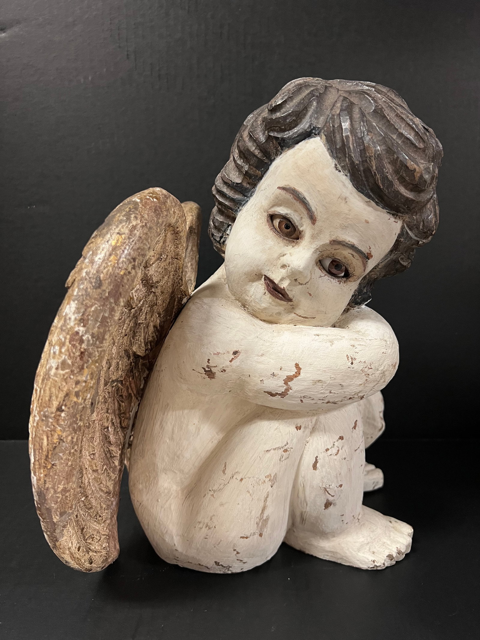 Carved Wood Sitting Angel: Religious Art Carved Wood Sitting Angel. The dimension is 13 inches high x 10 inches depth x 12 inches wide. Please be aware that some of the items are vintage, secondhand, old ages, antiques and may