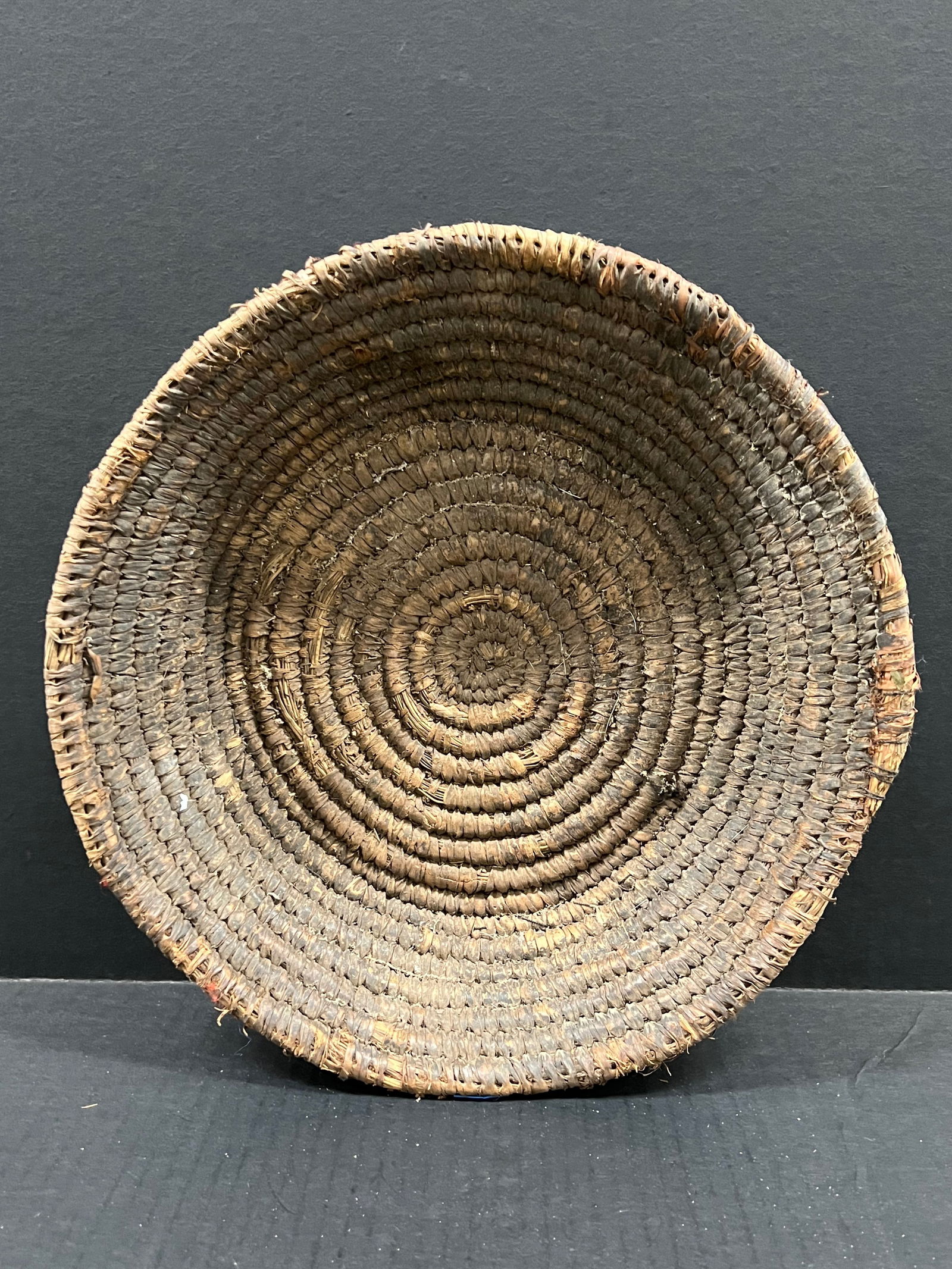 Nigerian Handmade Sisal Fiber Woven Bowl: African Tribal Art Nigerian Handmade Sisal Fiber Wooden Bowl. The dimension is 11.5 inches high x 11.5 inches wide. Please be aware that some of the items are vintage, secondhand, old ages, antiques