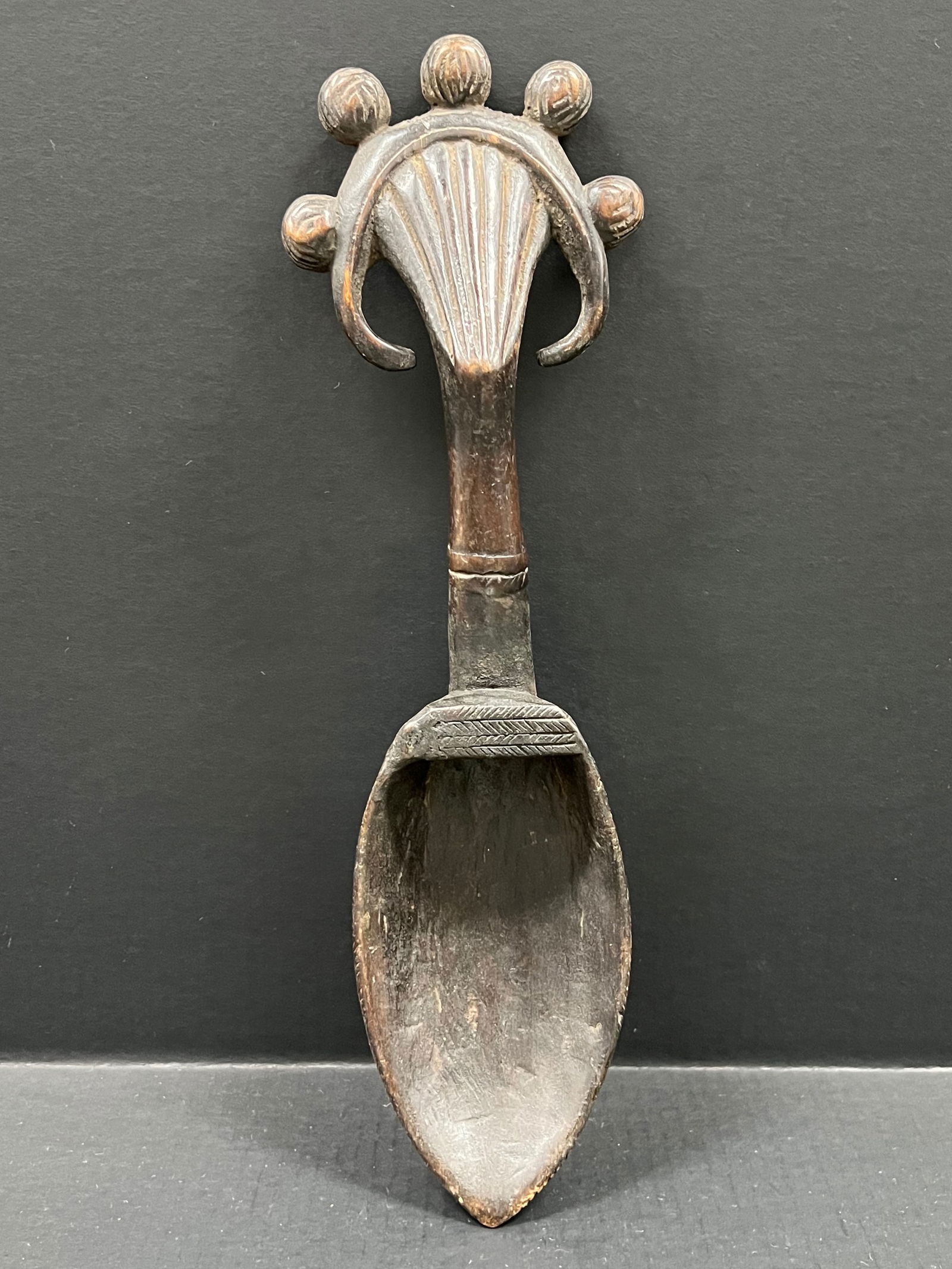 Carved Wood Dan Spoon: African Tribal Art Carved Wood Dan Spoon. The dimension is 18.5 inches high x 5.5 inches wide. Please be aware that some of the items are vintage, secondhand, old ages, antiques and may have a defects
