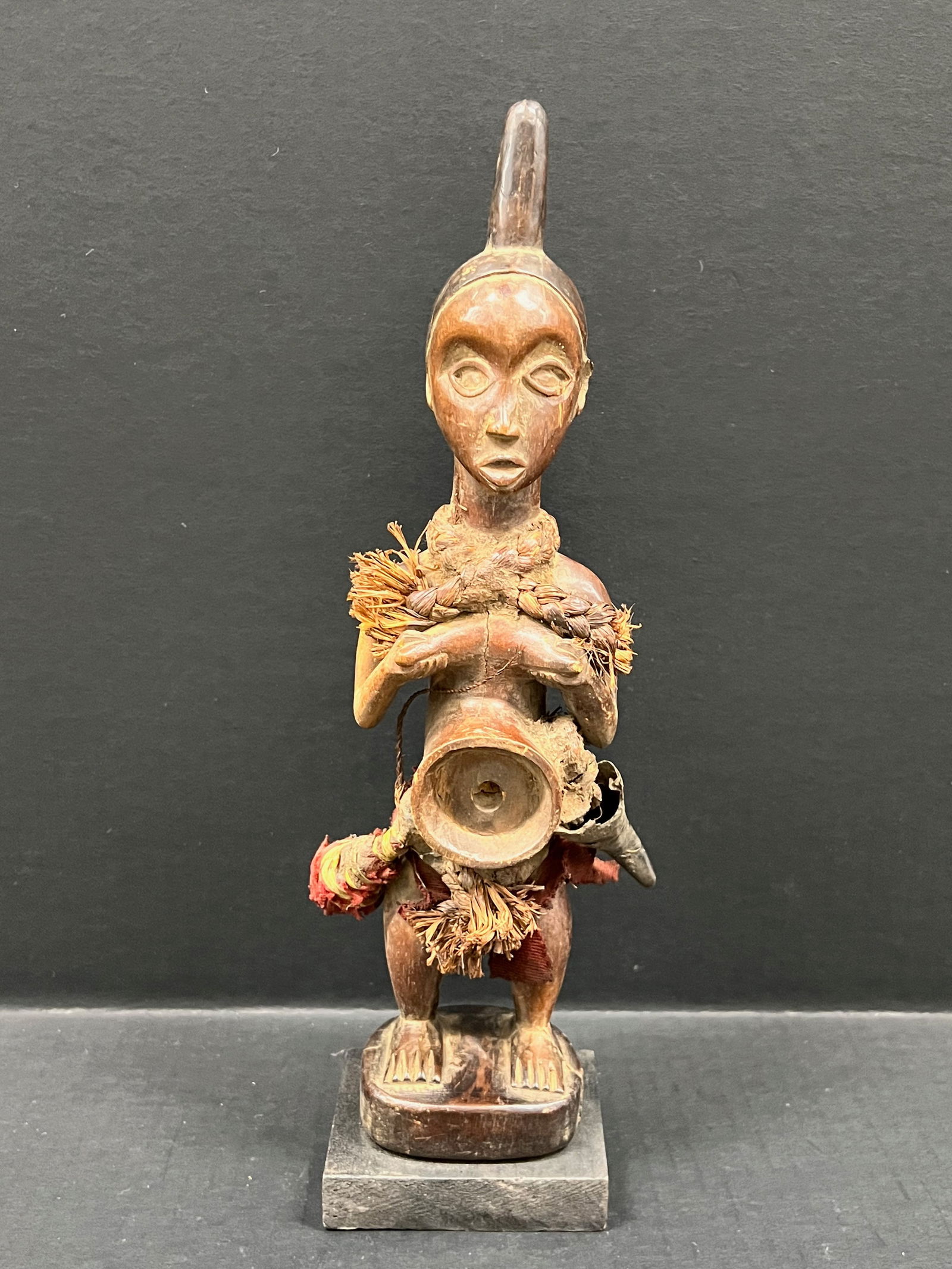 Carved Wood Yaka Fetish Statue: African Tribal Art Carved Wood Yaka Fetish Statue. The dimension is 13.5 inches high x 3.5 inches wide. Please be aware that some of the items are vintage, secondhand, old ages, antiques and may have