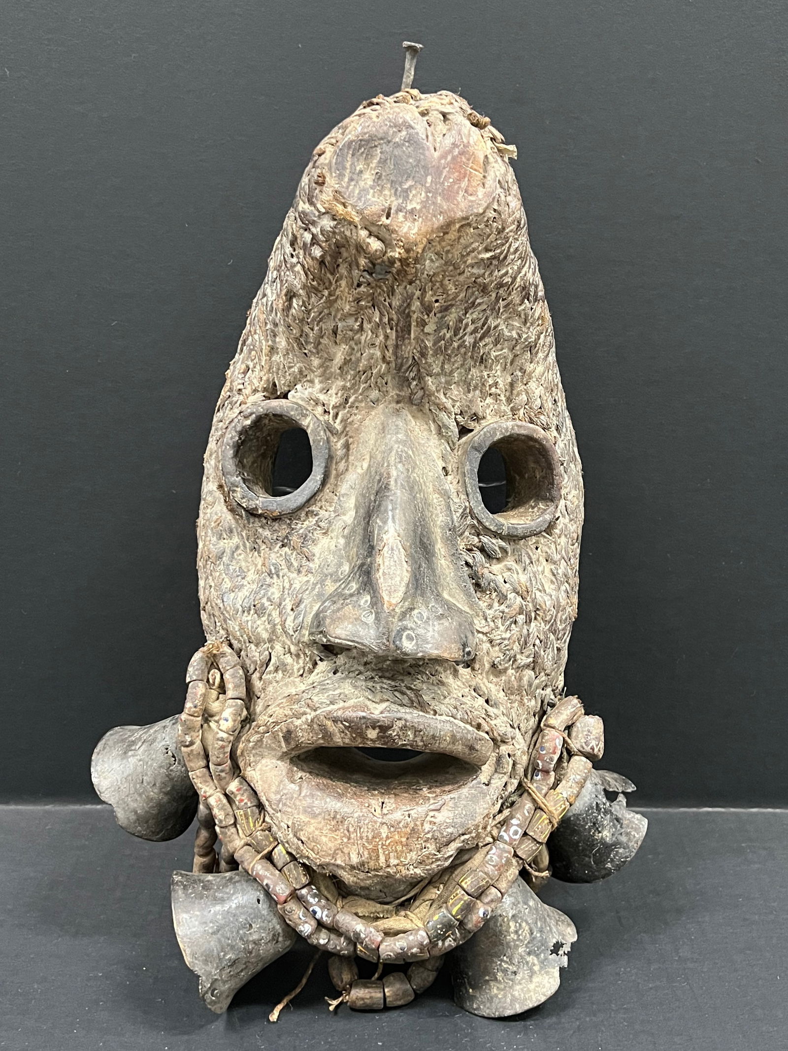 Carved Wood Dan Grebo Mask: African Tribal Art Carved Wood Dan Grebo Mask. The dimension is 16 inches high x 11 inches wide. Please be aware that some of the items are vintage, secondhand, old ages, antiques and may have a defec