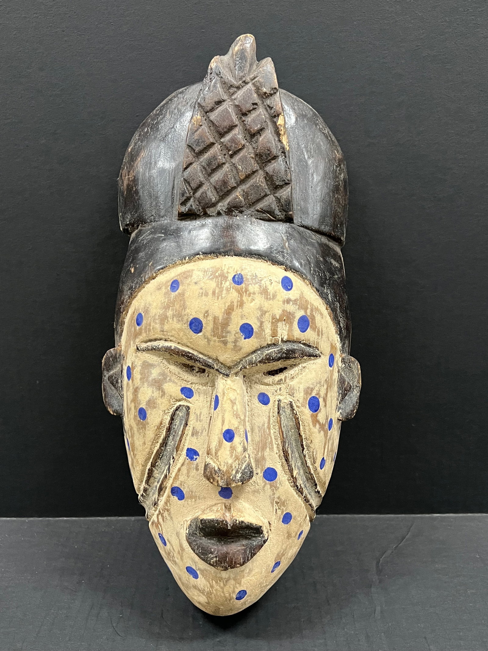 Carved Wood Ibo Mask: African Tribal Art Carved Wood Ibo Mask. The dimension is 16 inches high x 8 inches wide. Please be aware that some of the items are vintage, secondhand, old ages, antiques and may have a defects or s