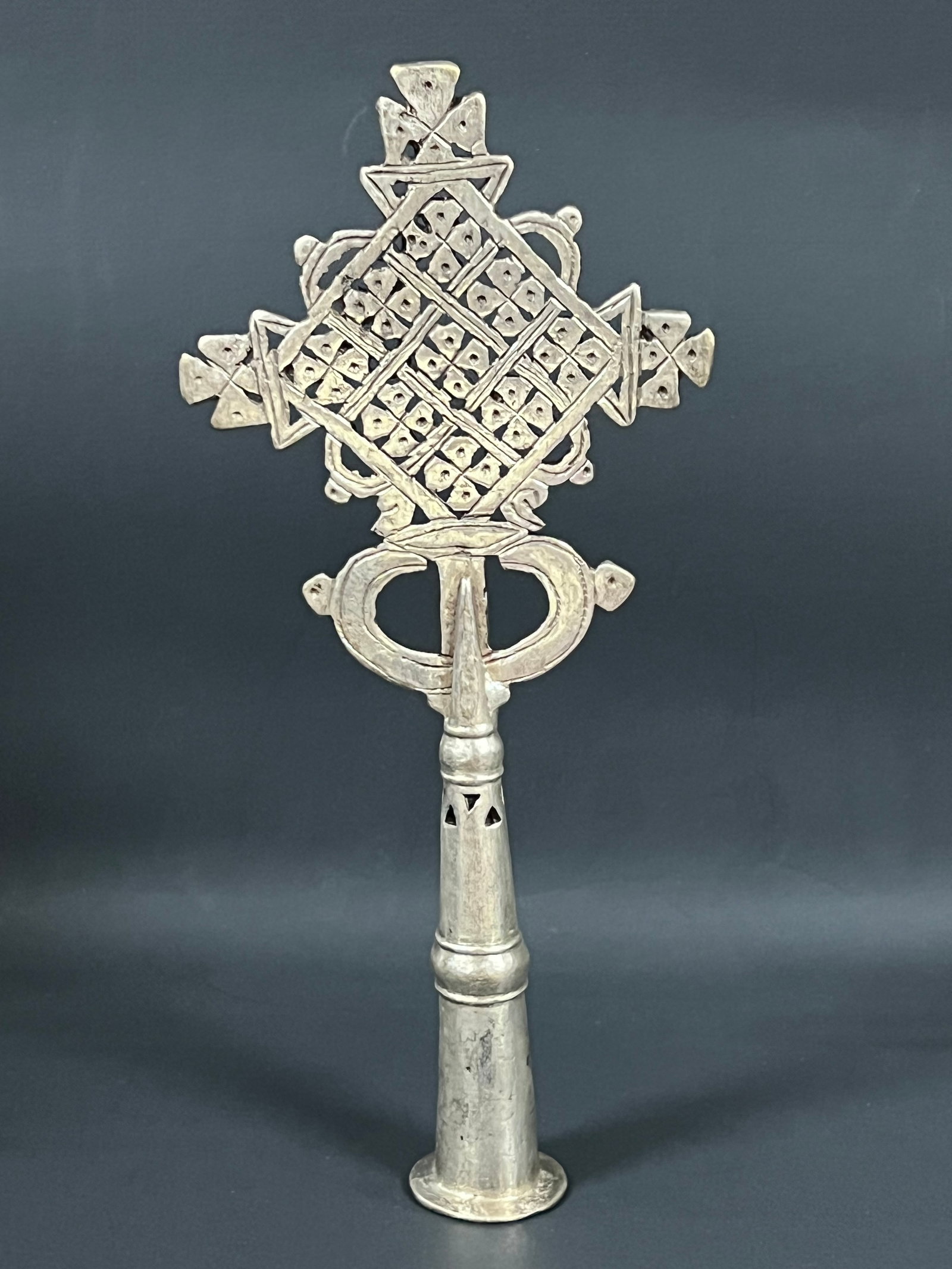 Ethiopian Metal Processional Coptic Cross: African Tribal Art Ethiopian Metal Processional Coptic Cross. The dimension is 9 inches high x 4 inches wide. Please be aware that some of the items are vintage, secondhand, old ages, antiques and may