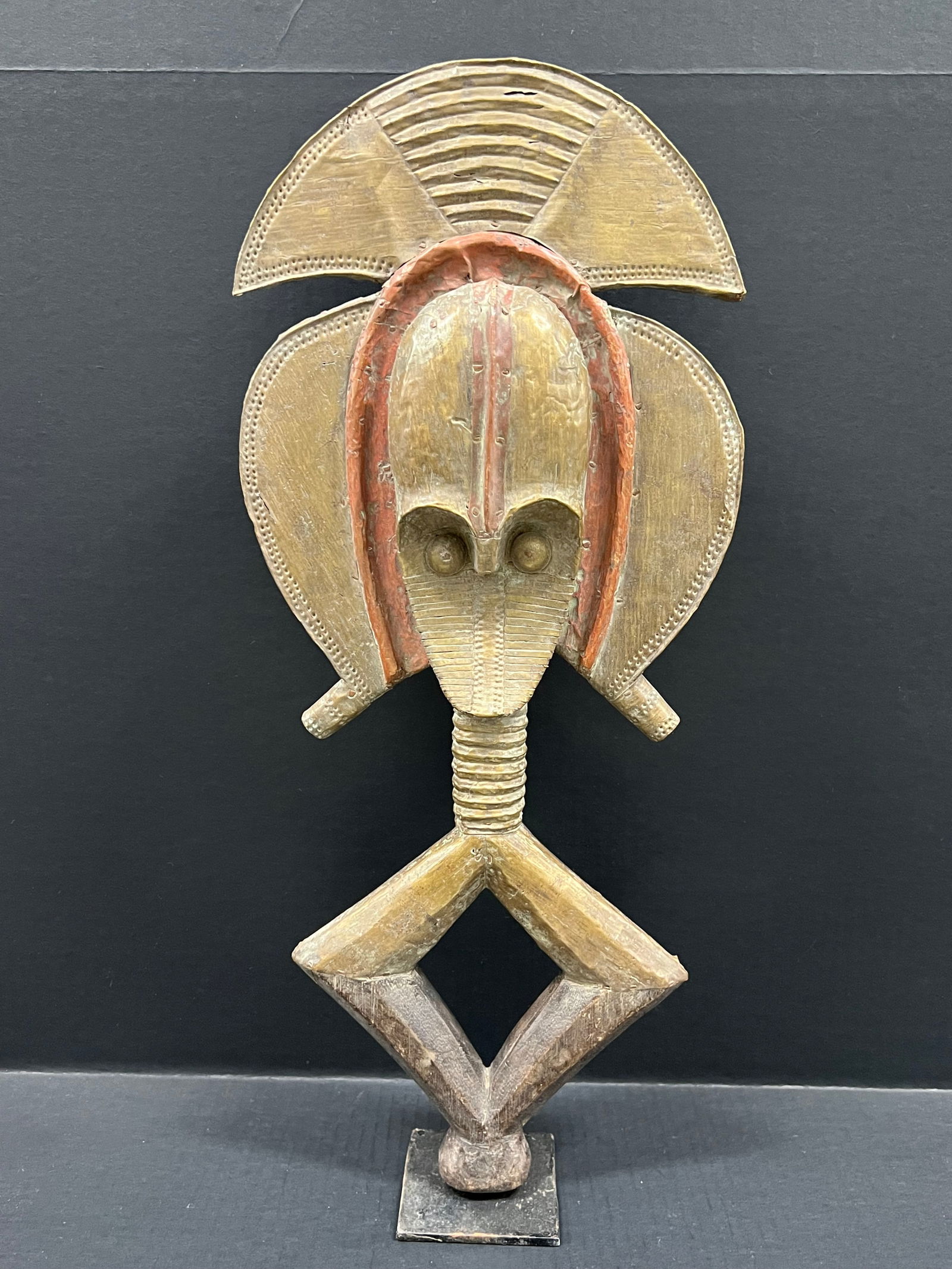 Bacota Reliquary Guardian Statue with Stand: African Tribal Art Bacota Reliquary Guardian Statue. The dimension is 23 inches high x 11.5 inches wide. Please be aware that some of the items are vintage, secondhand, old ages, antiques and may have