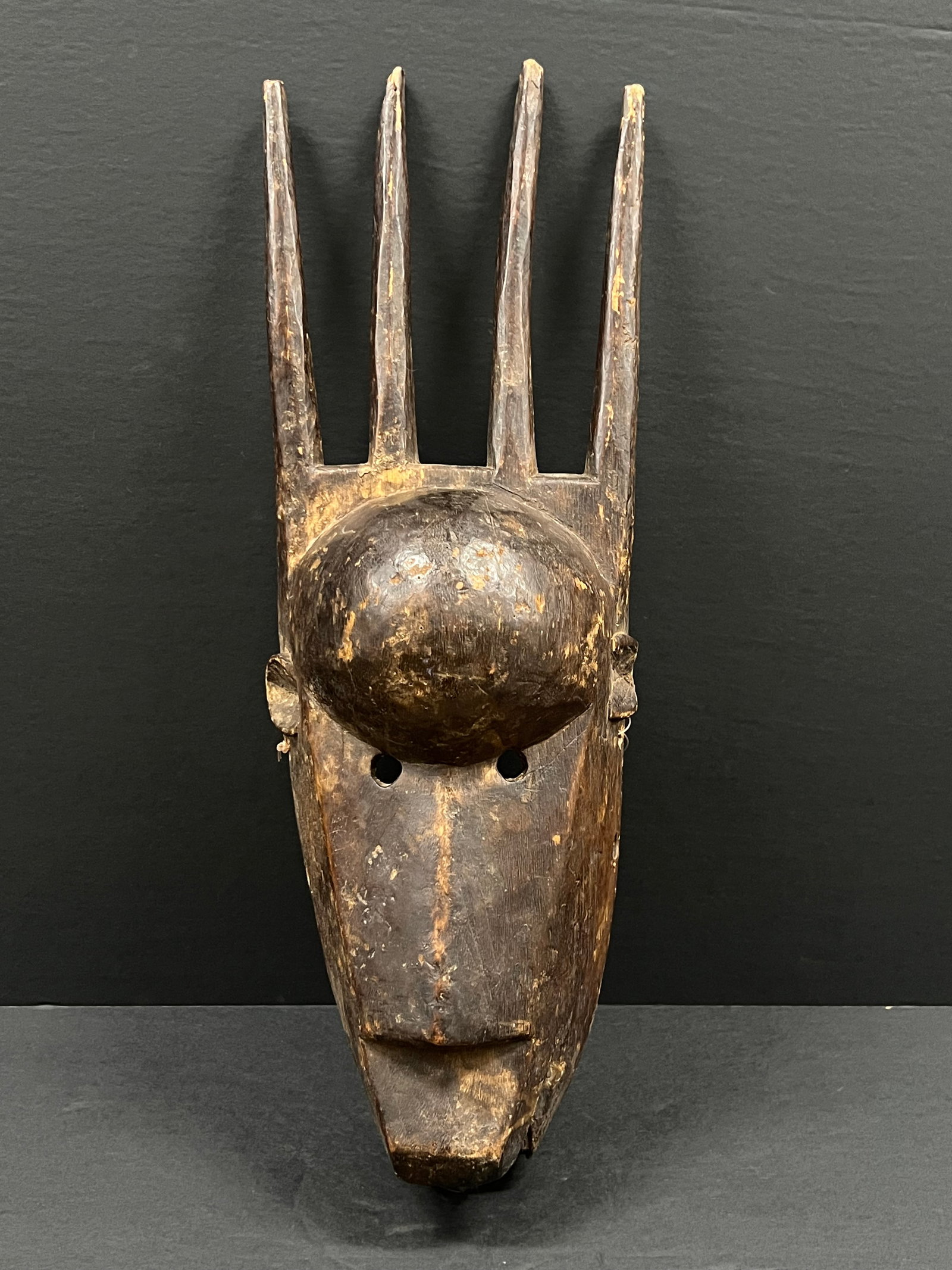 Bamana Mask: African Tribal Art Bamana Mask. The dimension is 19 inches high x 7 inches wide. Please be aware that some of the items are vintage, secondhand, old ages, antiques and may have a defects or sign of ag